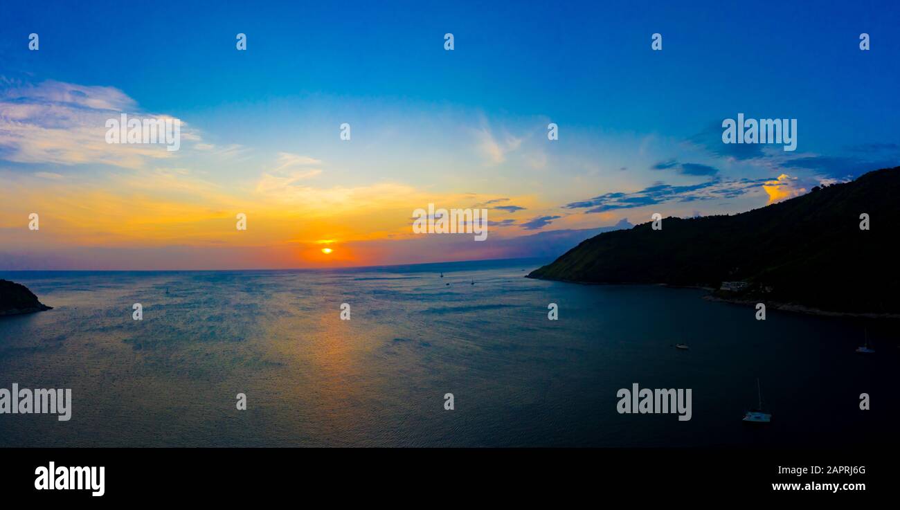 aerial view sunset above Nai Harn beach. Nai Harn beach is a famouse landmark and popular sunset viewpoint of Phuket Thailand Stock Photo