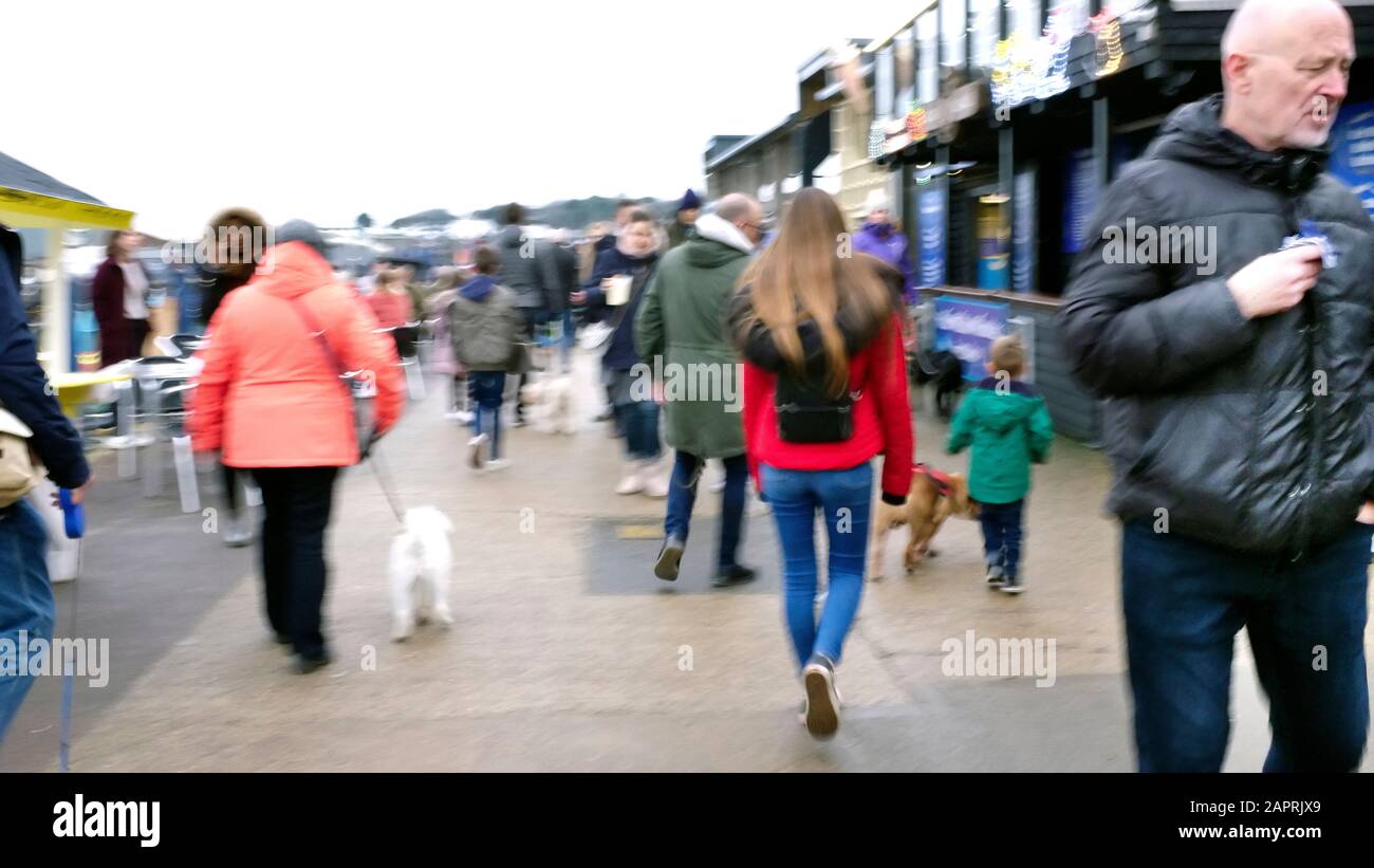 A bustling crowd of people in Whiststable market in blurred motion. Stock Photo