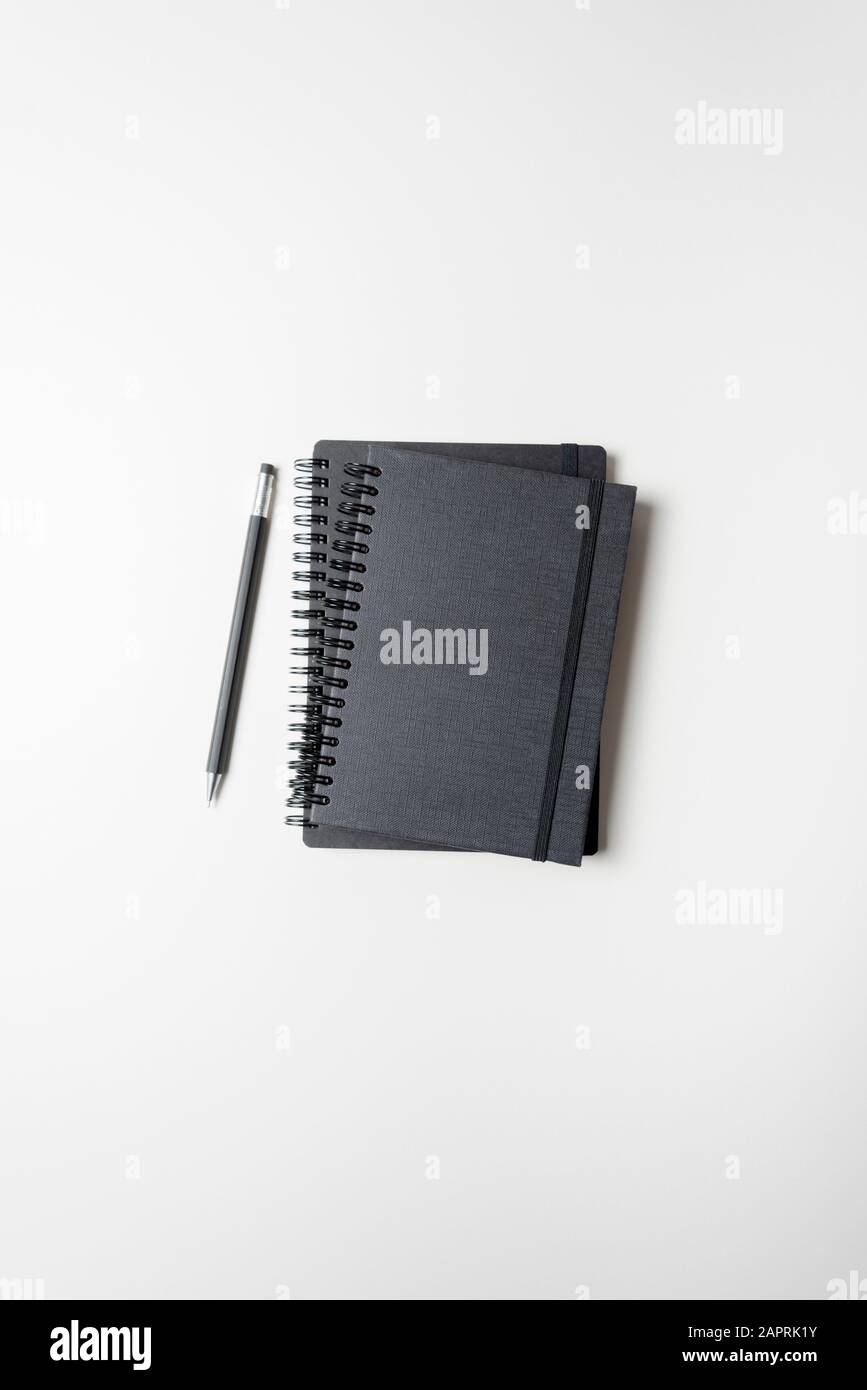 Two black note pads isolated on a white background. January 2020. Please credit: Phillip Roberts Stock Photo