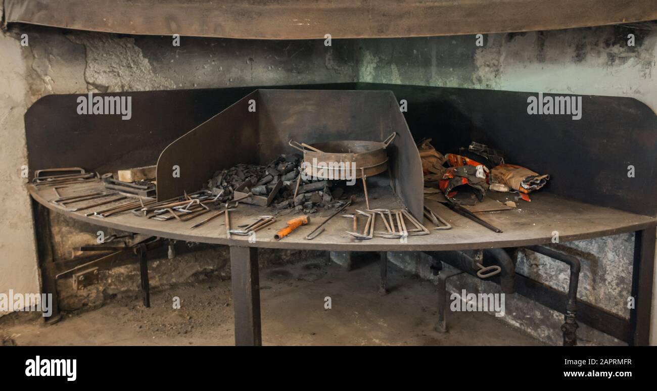 Blacksmith's table inside an old historical blacksmith museum in Slovenia Stock Photo