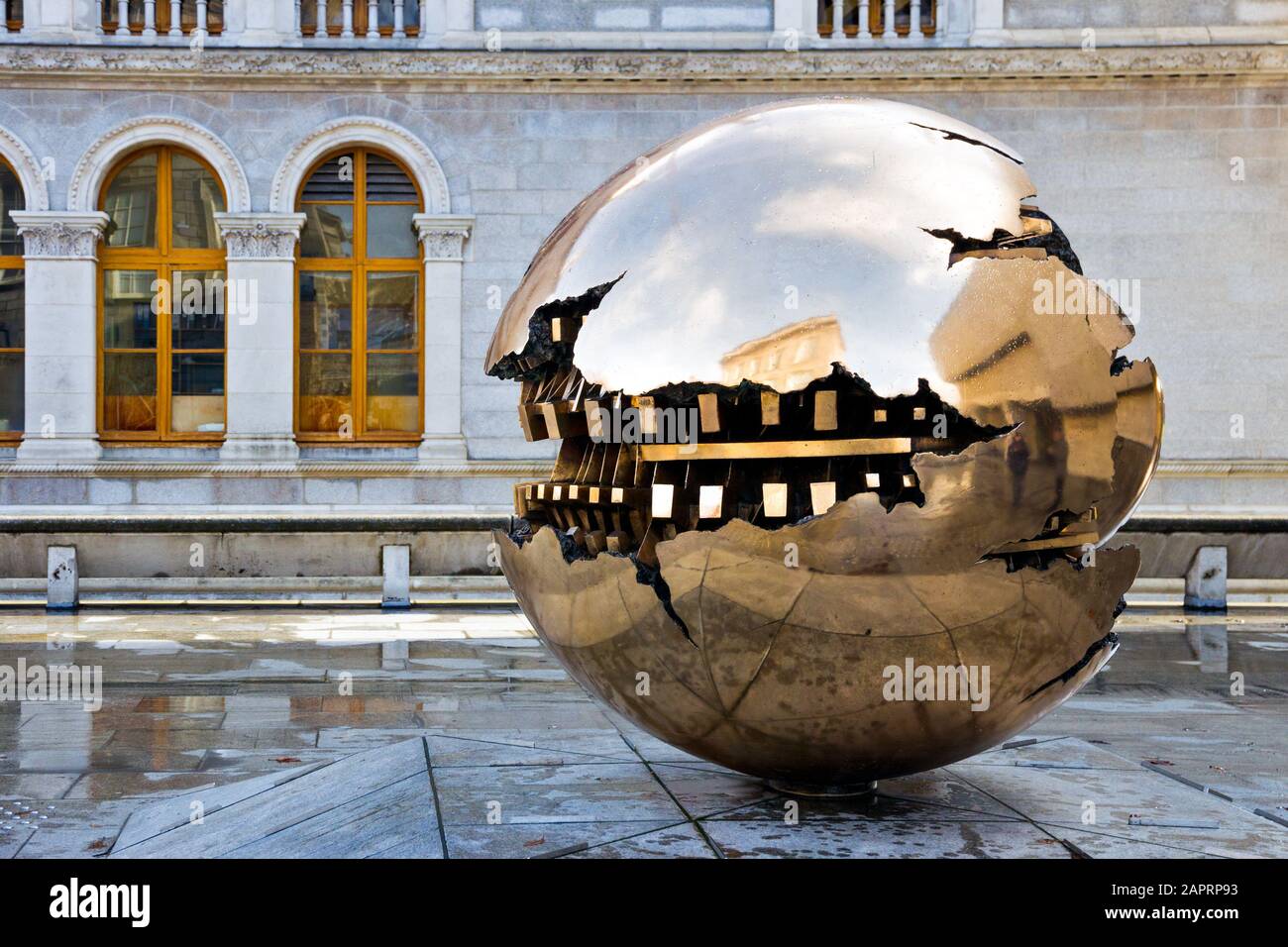 DUBLIN, IRELAND - FEB 15, 2014: Abstract spherical metal sculpture on a courtyard of Trinity College. Stock Photo