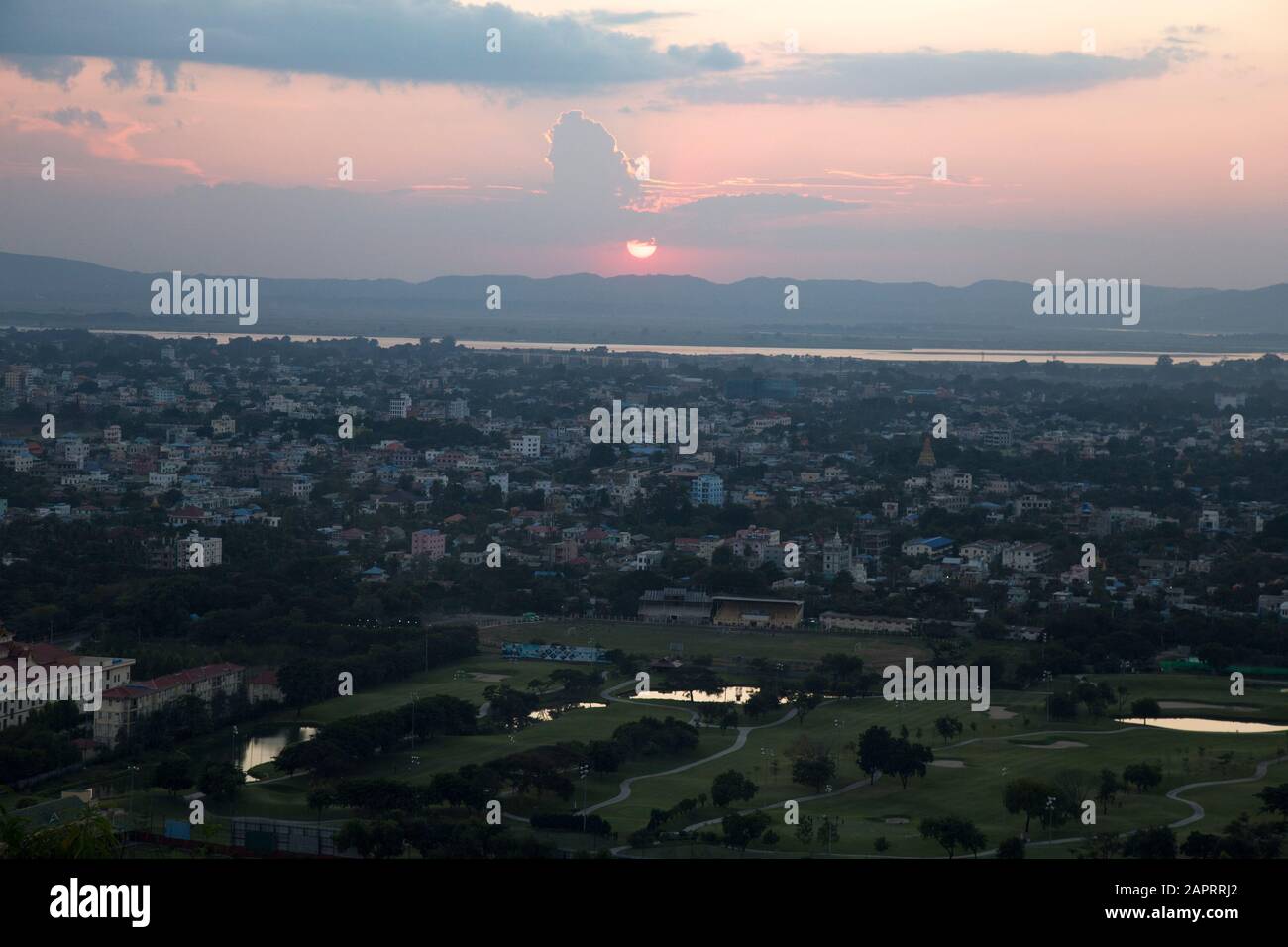 Manadaly's cityscape druing a red and orange sunset, Myanmar Stock Photo