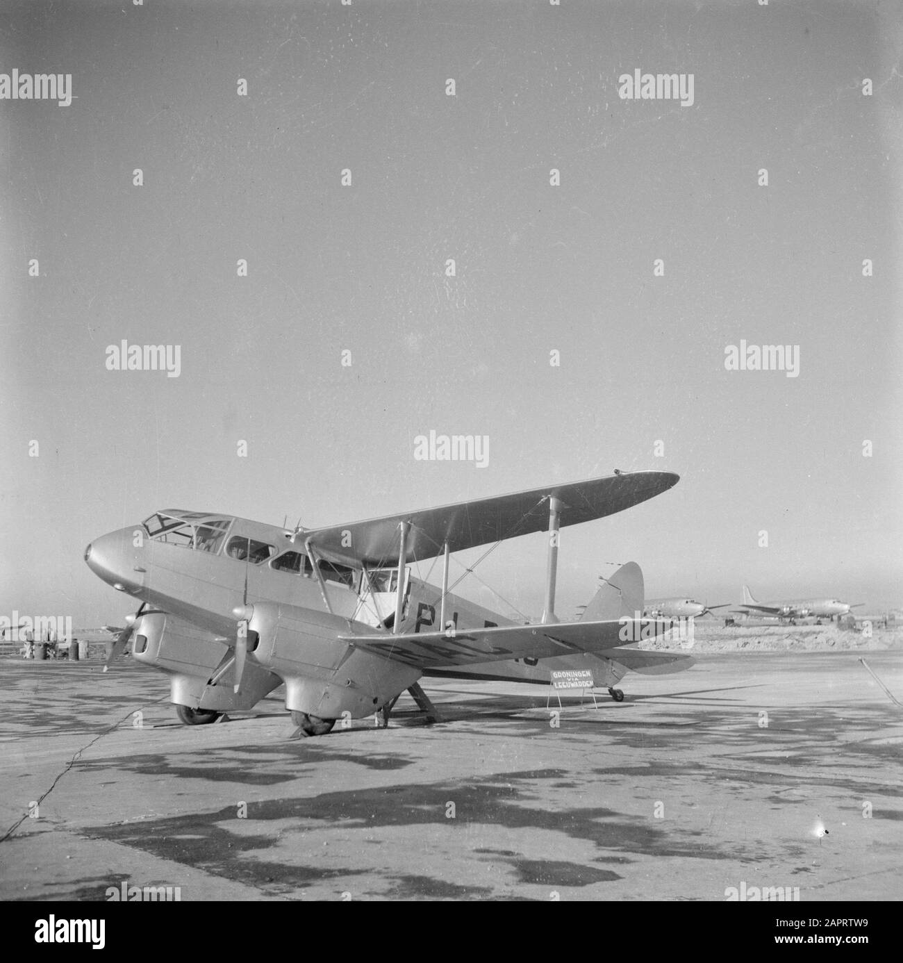 Schiphol  A De Haviland Dragon Rapide for the flight service Groningen via Leeuwarden Date: July 1945 Location: Noord-Holland, Schiphol Keywords: aircraft, airports Institution name: Schiphol Stock Photo