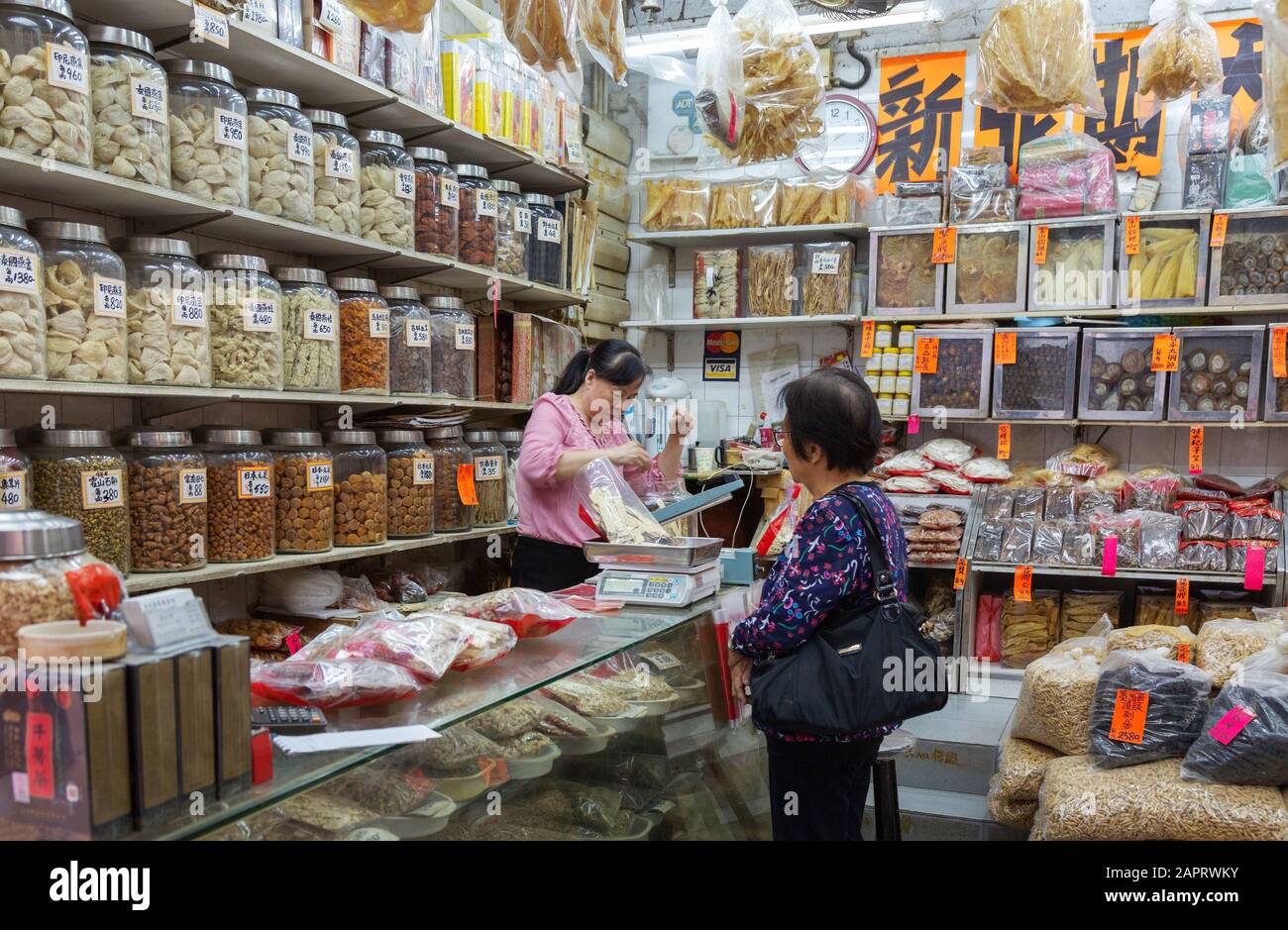 Hong Kong lifestyle a local woman shopping for food in a seafood shop