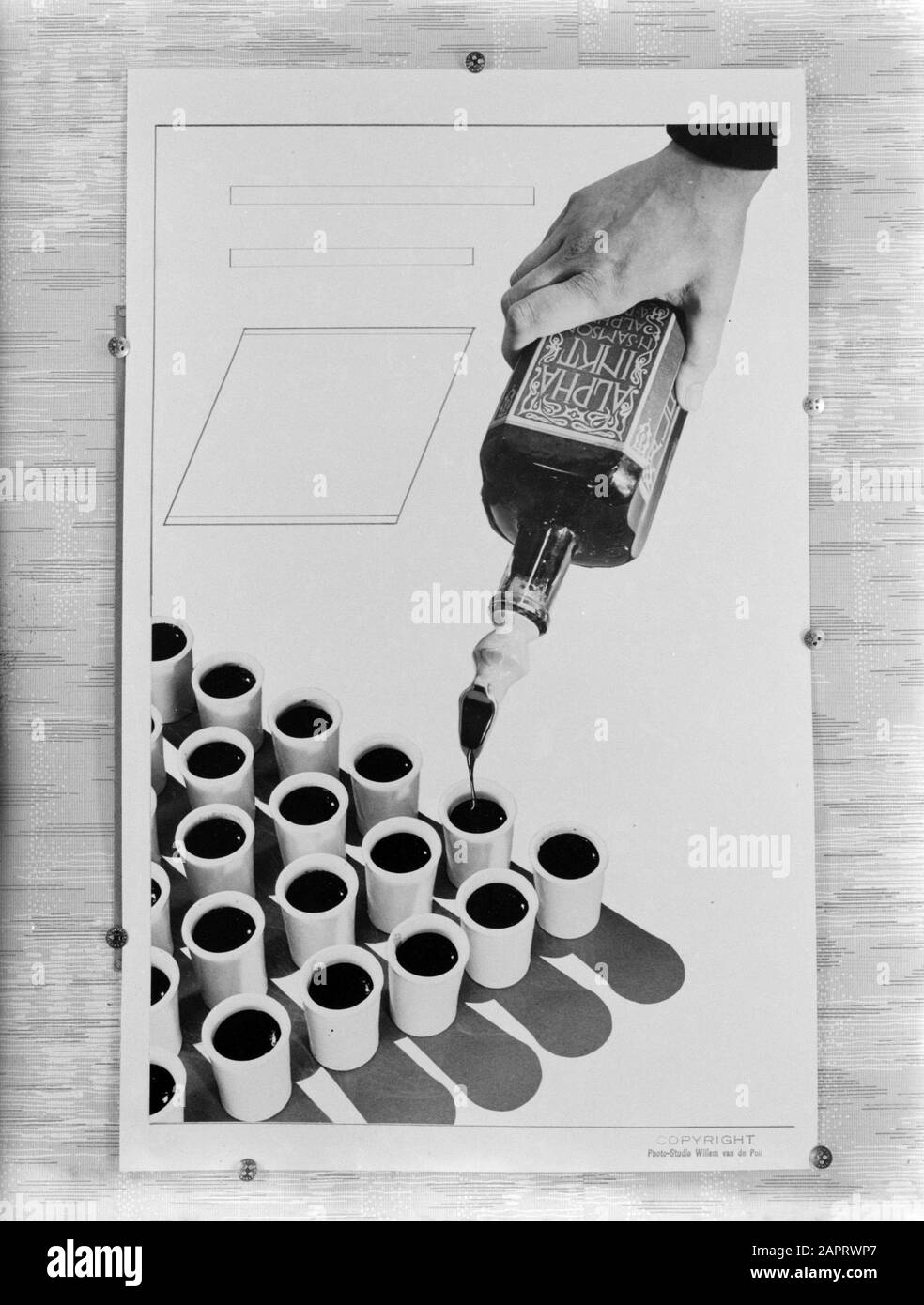 Advertising Photography One hand pours Alpha ink in the ink jars ...