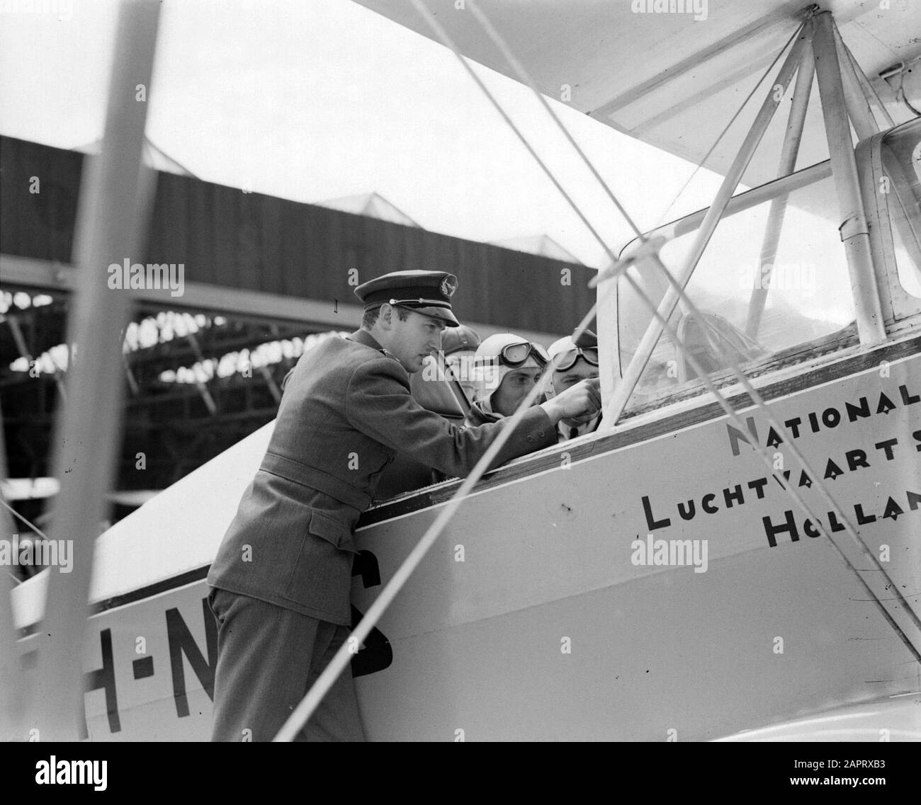 National Aviation School Holland  A Koolhoven FK 46 biplane of the National Aviation School Holland with adspirant pilot an instructor Date: July 1935 Location: Amsterdam, North Holland Keywords: pilots, flight training, aircraft Stock Photo