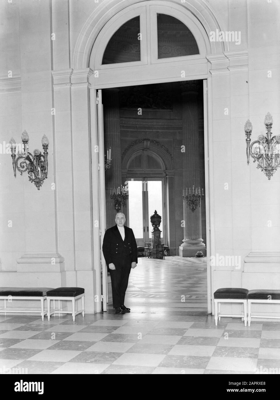 Royal Family Belgium  A lackey stands at the door of a hall in the palace in Laeken Date: 1934 Location: Belgium, Laeken Keywords: interiors, lackeys, palaces Stock Photo
