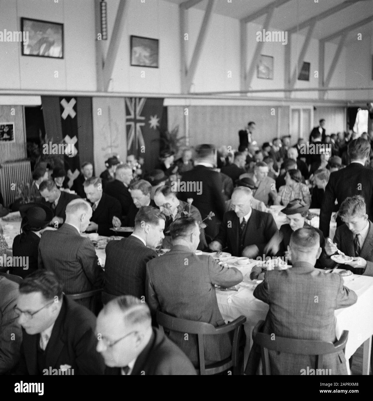 KLM party lunch  A lunch organised for KLM staff and staff. Date: 1936 Location: Amsterdam, Noord-Holland Keywords: meals, tables, employees Institution name: KLM, Schiphol Stock Photo