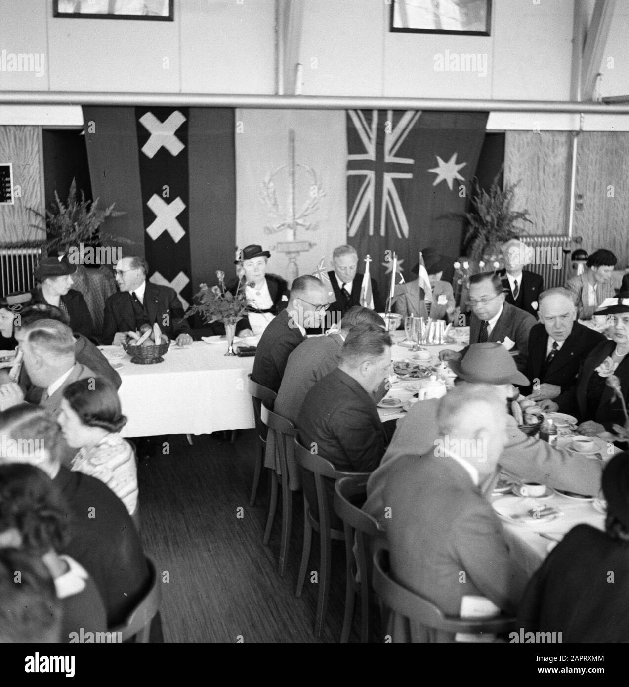 KLM party lunch  A lunch organised for KLM staff and staff. Date: 1936 Location: Amsterdam, Noord-Holland Keywords: meals, tables, employees Institution name: KLM, Schiphol Stock Photo