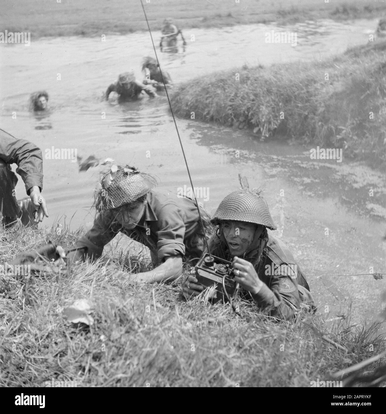 Military Reportage  A military exercise. A river must be crossed. Working on the crossing. A radio telegraphist at work Date: 1939 Keywords: military exercises Stock Photo