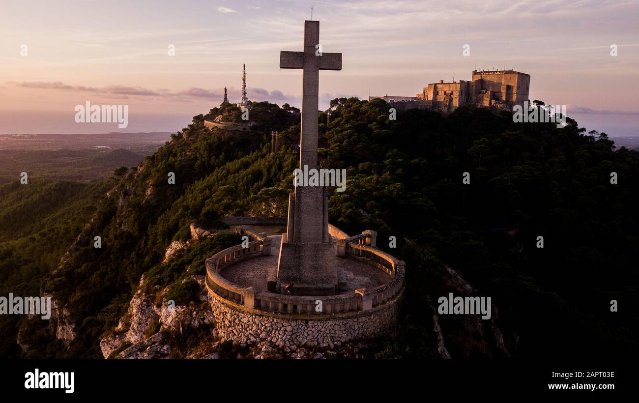 Sant Salvador big stone Cross in Majorca (Balearic Islands - Spain), Beautiful old stone cross during sunrise early in the morning Stock Photo