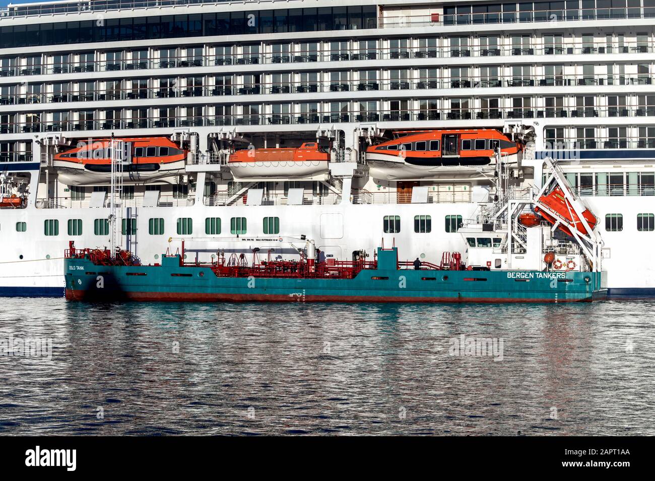 Tanker vessel Oslo Tank alongside the large cruise ship Viking Star at Skolten quay in port of Bergen, Norway. Stock Photo