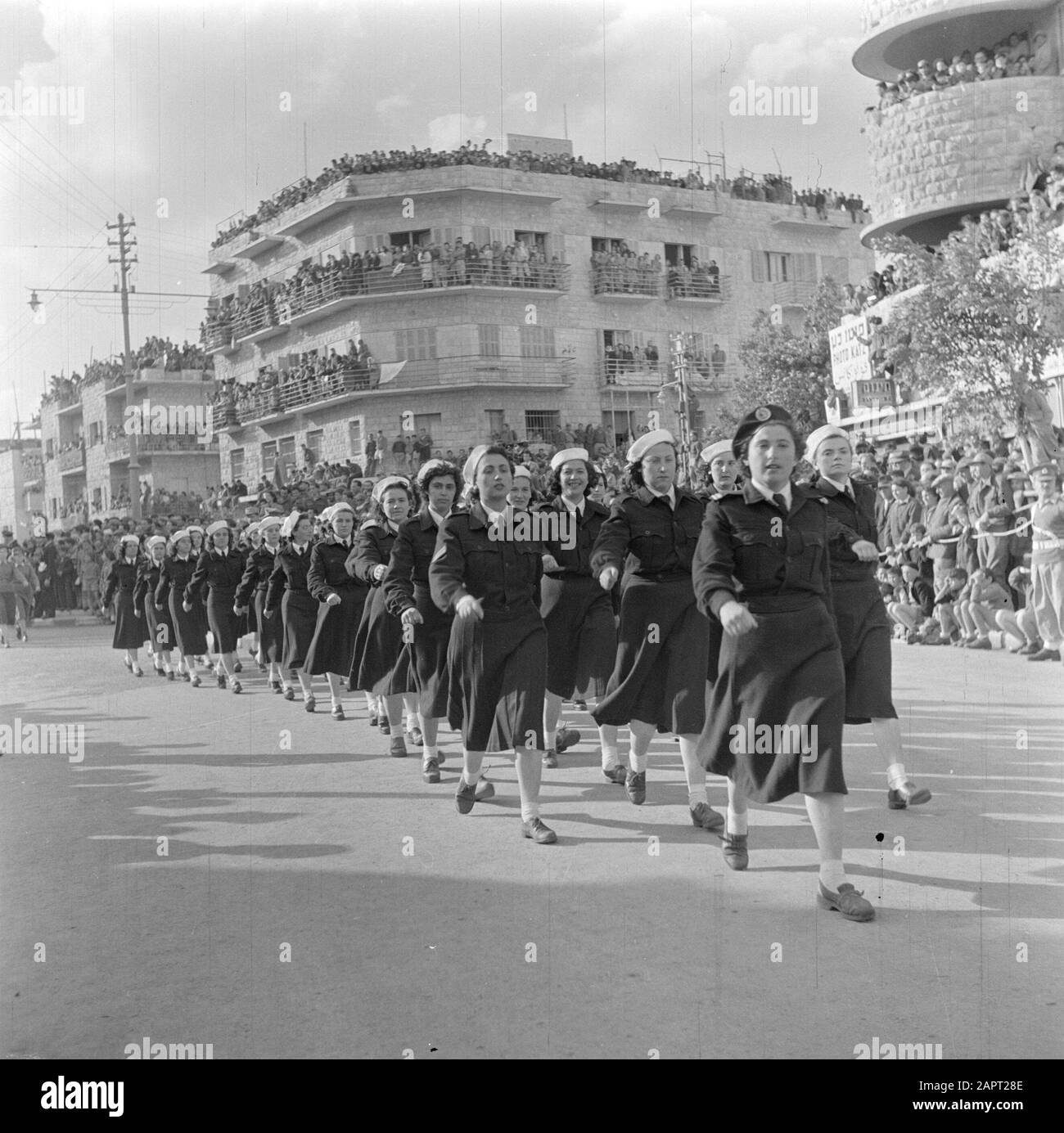Israel 1948-1949: Haifa  Female naval personnel unit during the military parade in Haifa on the occasion of the first anniversary of Israel's independence on May 15, 1949 Date: May 15, 1949 Location: Haifa, Israel Keywords: architecture, navy, military parades, public, uniforms, women Stock Photo