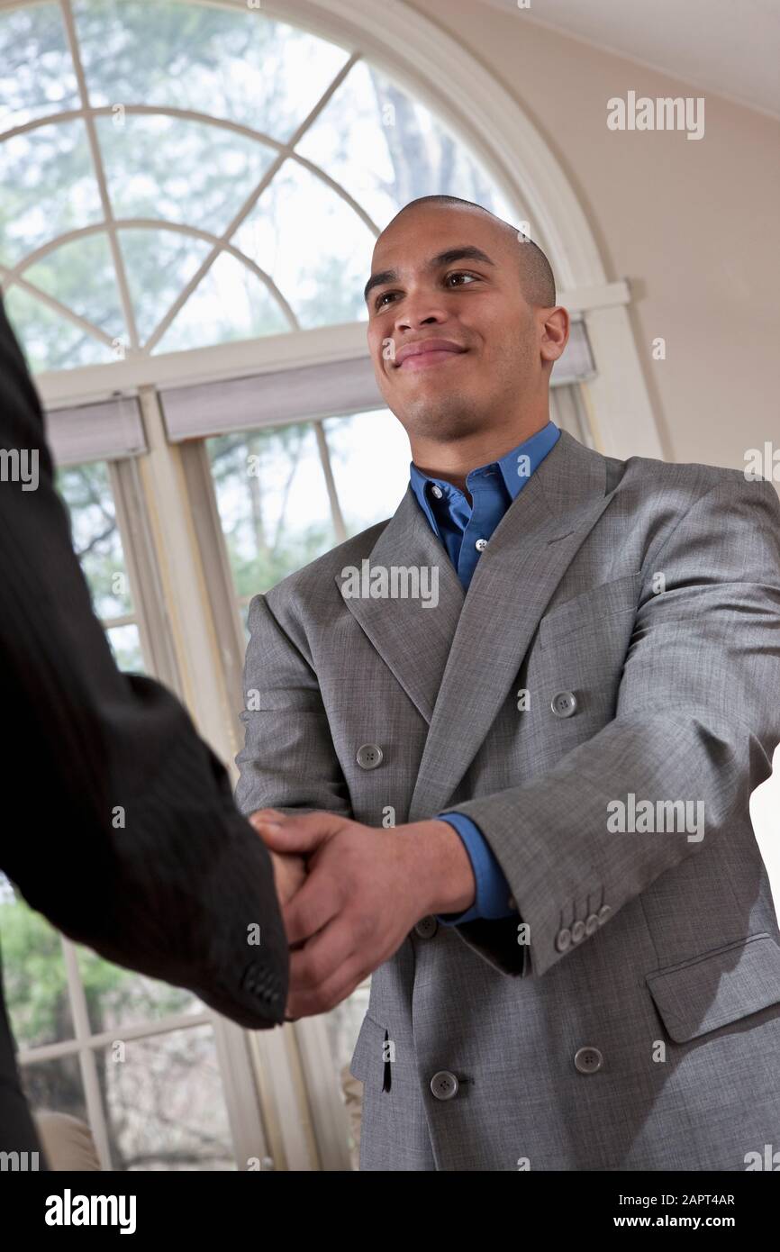 Businessmen shaking hands Stock Photo