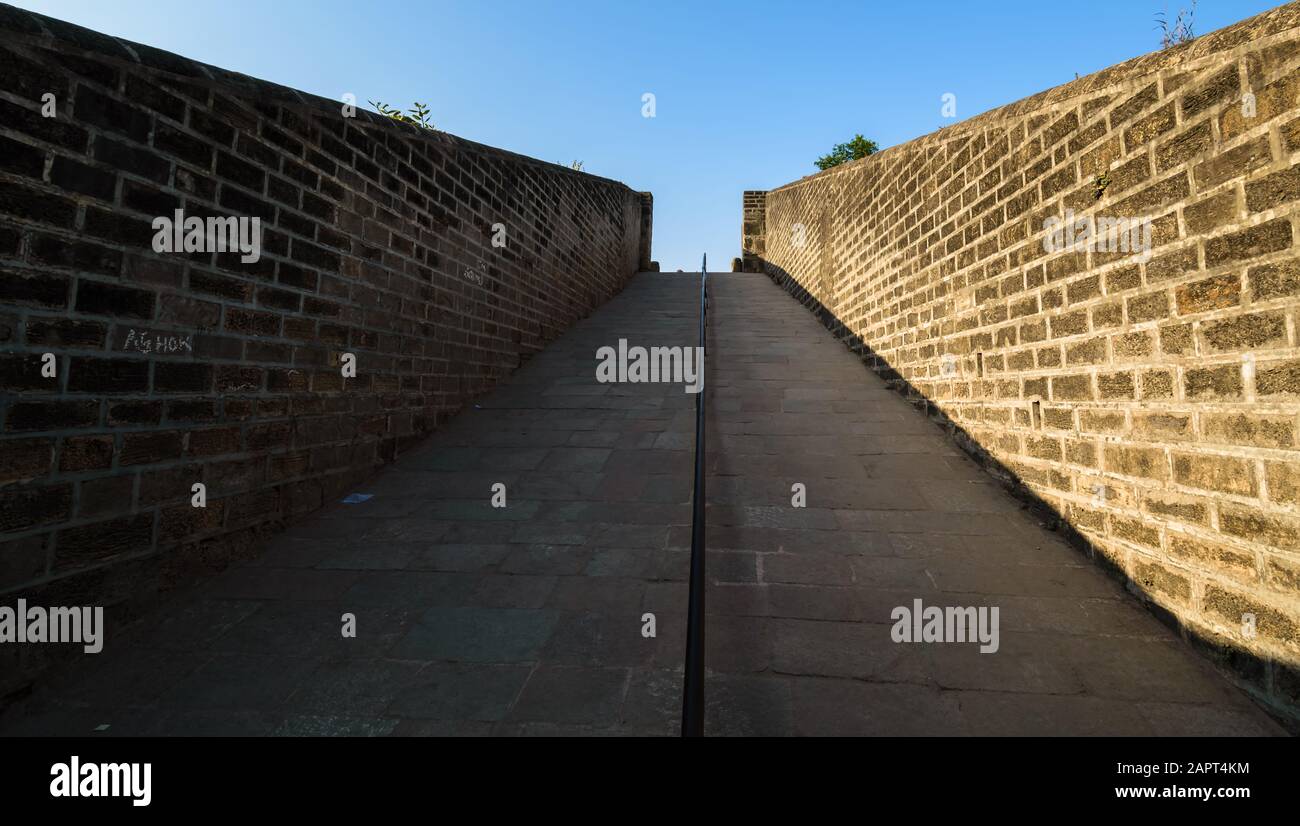 A passage through the fort walls of the ancient Portuguese built Diu fort in the island of Diu in India. Stock Photo