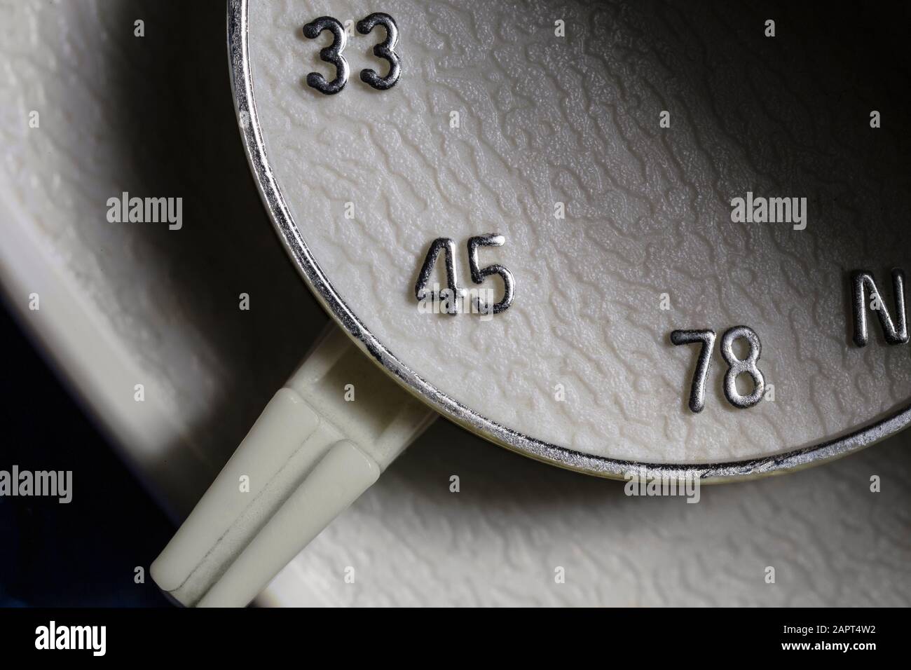 Macro close up photograph of 33, 45 or 78 rpm selector switch on vintage record player turntable. Stock Photo