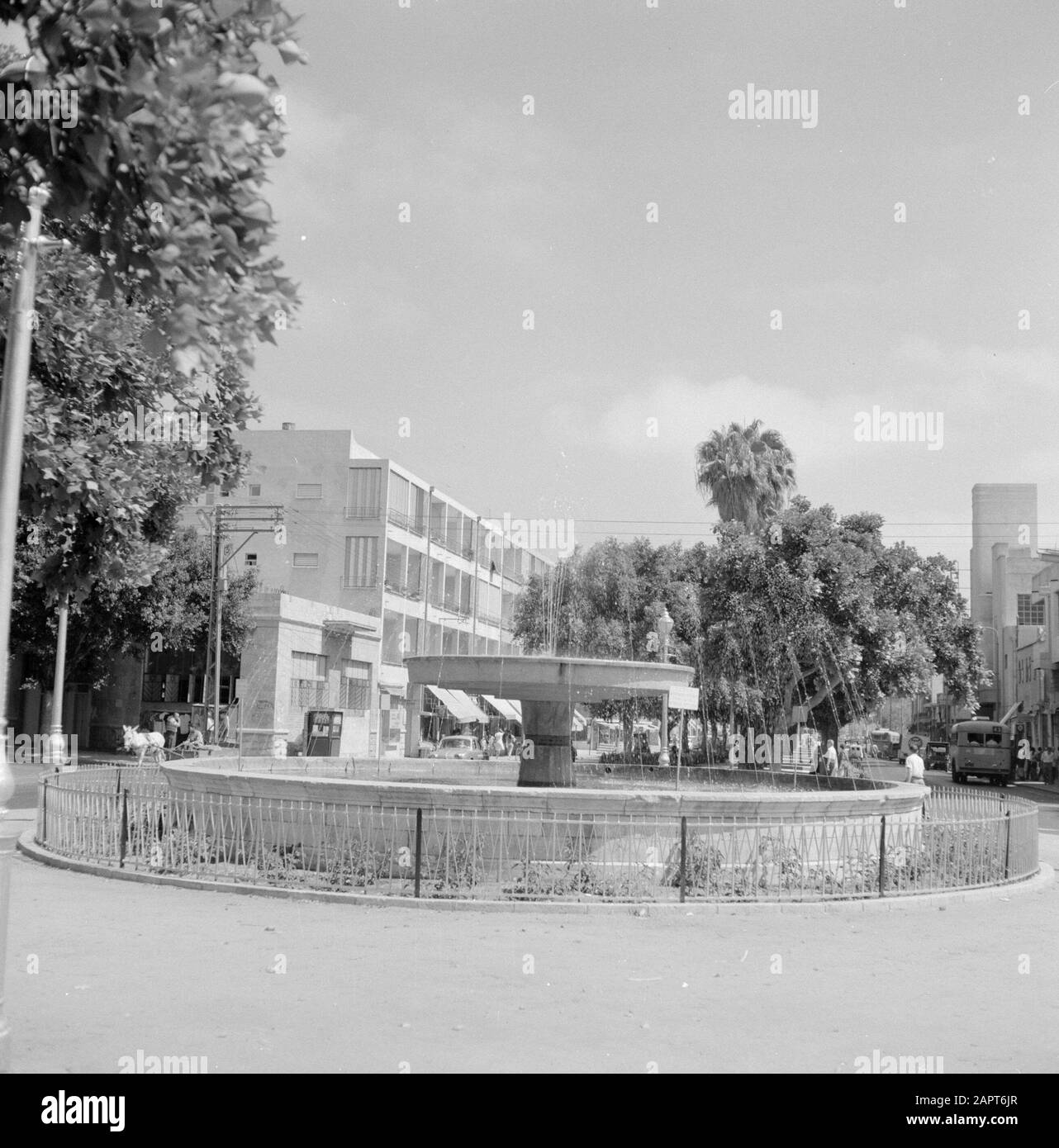 Israel: Jaffa (Tel Aviv)  Fountain on square with buildings and trees in the background Annotation: Jaffa is now a city district of Tel Aviv Date: undated Location: Israel, Jaffa, Tel Aviv Keywords : trees, fountains, squares, street images Stock Photo