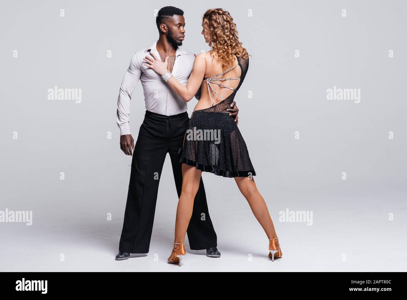 couple dancers posing over white background dance school concept 2APT80C