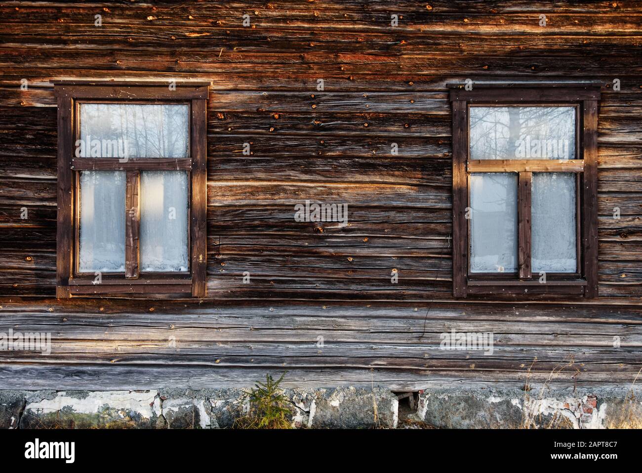 Windows on old log house Stock Photo