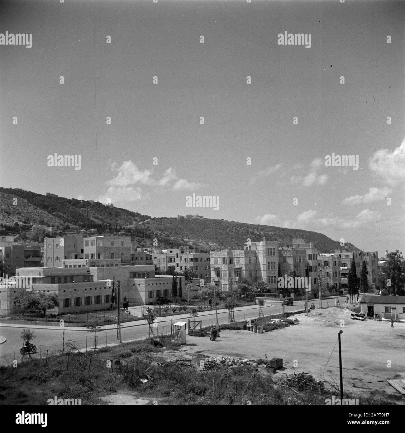 Israel 1948-1949: Haifa  Buildings including a hotel (r), with in the foreground an undeveloped land Date: 1948 Location: Haifa, Israel Keywords: apartment blocks, hotels, street images Stock Photo