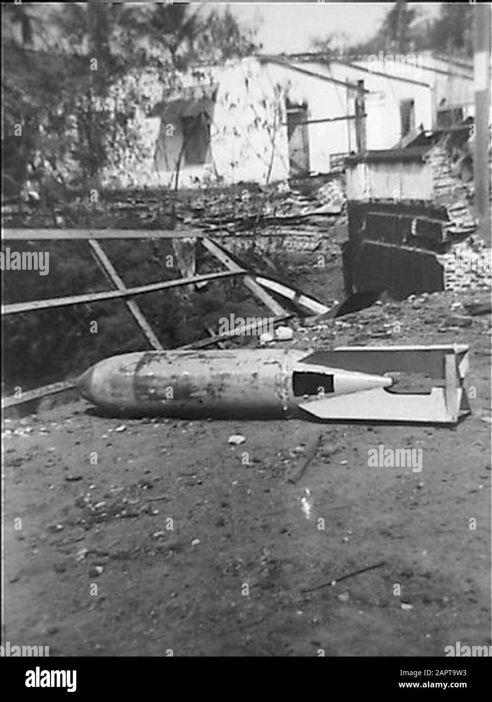Belongs to art. W.B. Lute. Grässer  No Caption Annotation: Aircraft bomb lies unexploded on a bridge Date: 27 August 1947 Location: Indonesia, Indonesia, Dutch East Indies, Dutch East Indies Keywords: bombs, devastations Stock Photo