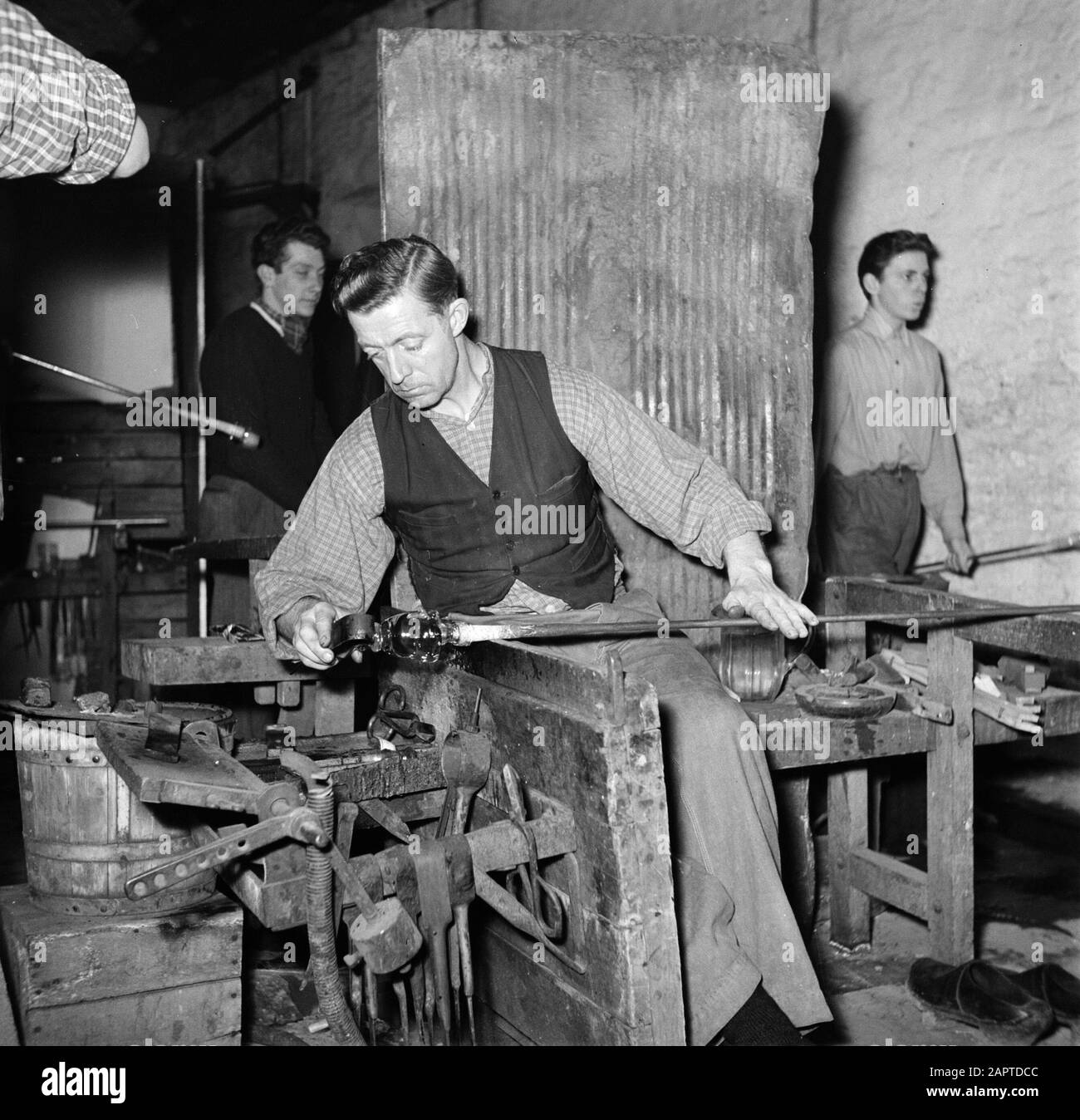 In the Holmegaard Glass Factory Glass blowers at work in the factory