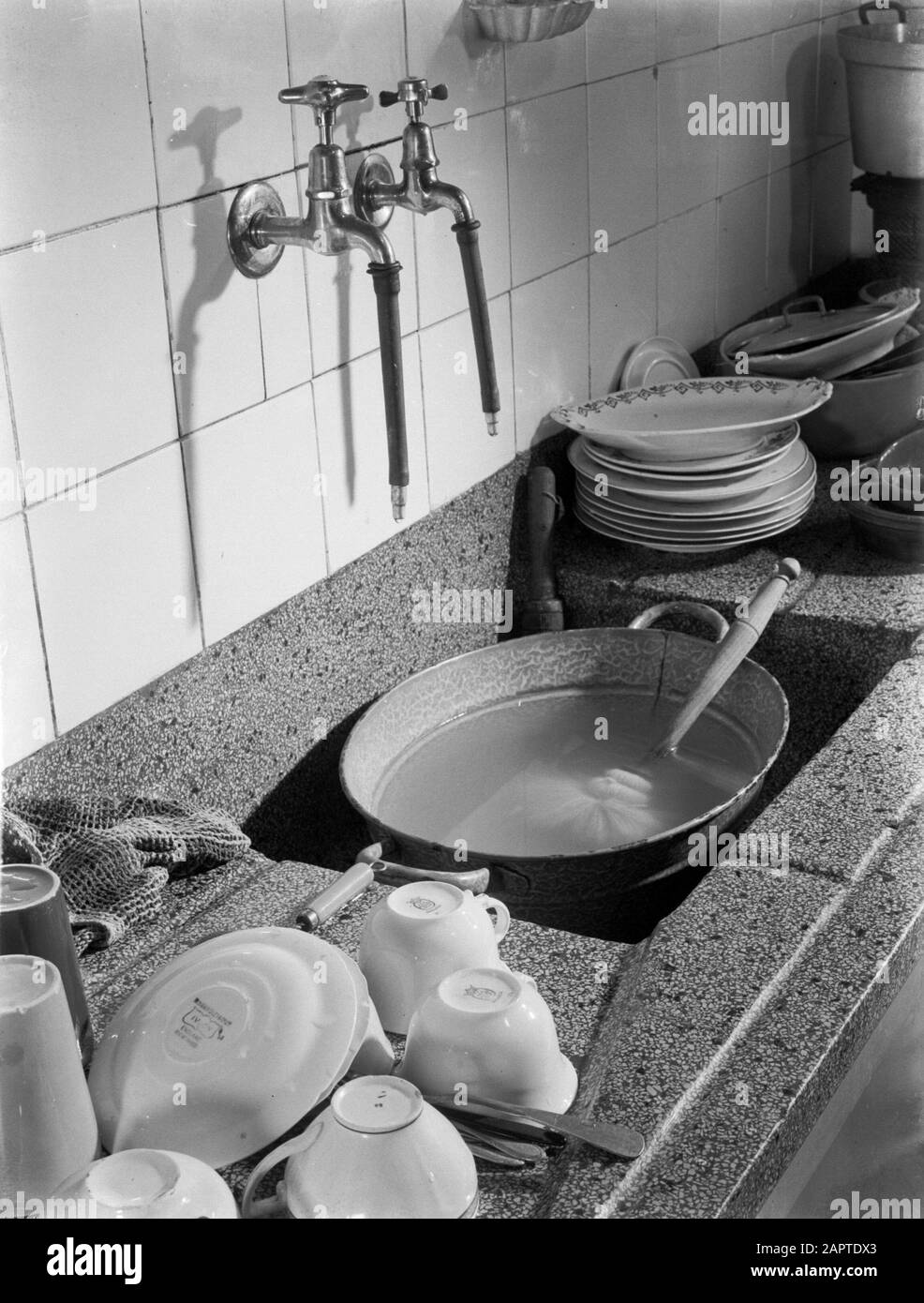 Family photos  Sash and countertop with dishes Date: 1933 Keywords: kitchens Stock Photo