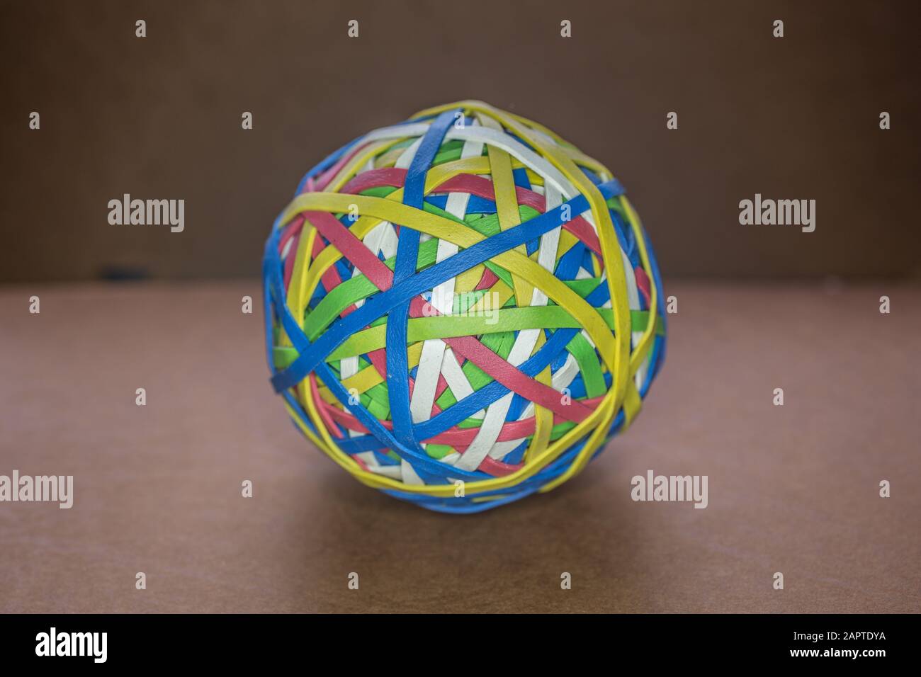 Rubber bands of different colors stretched into a ball Stock Photo Alamy
