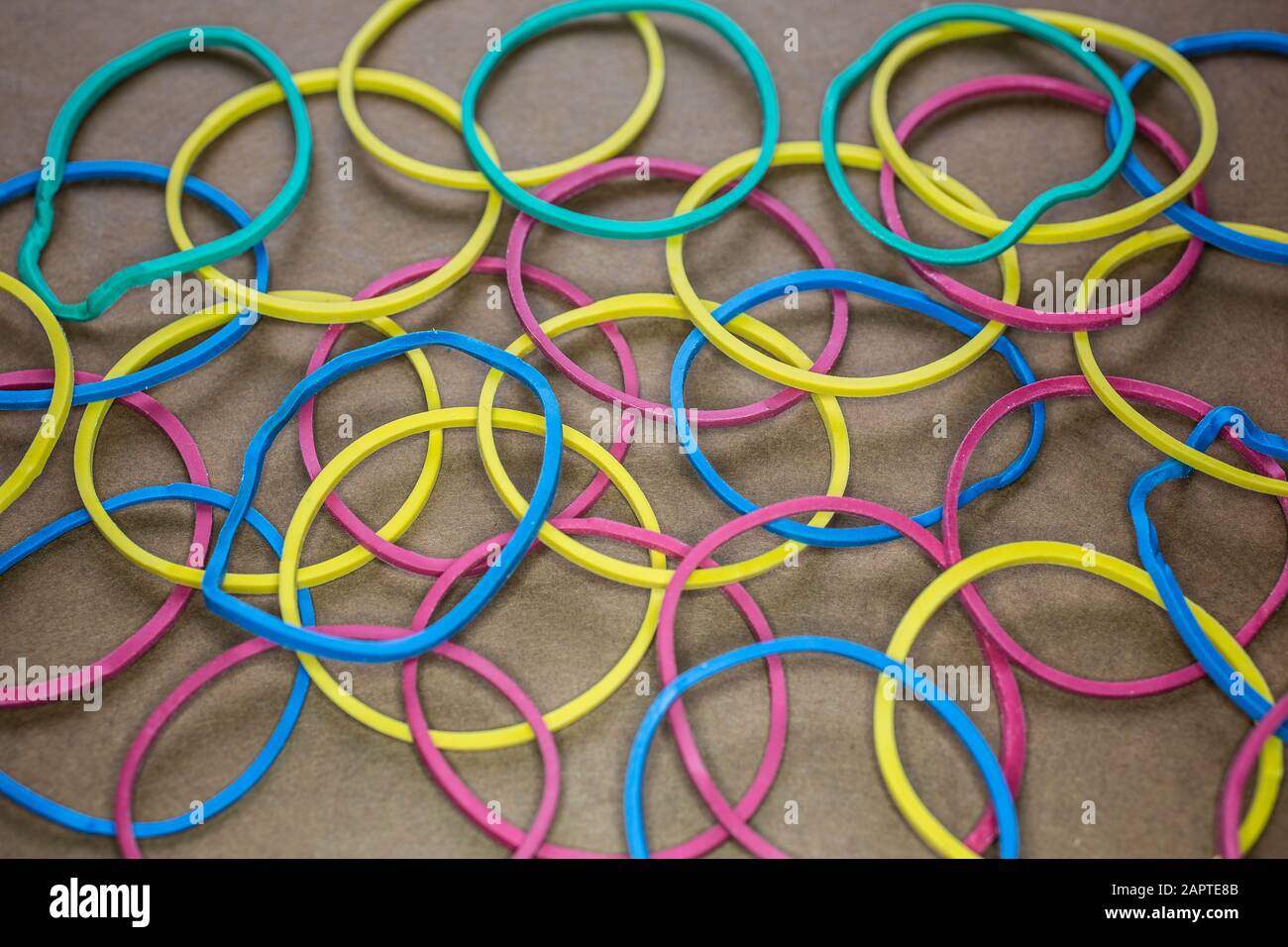 Rubber bands of different colors stretched into a ball Stock Photo Alamy