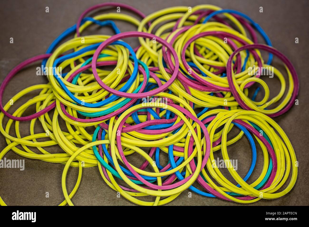 Rubber bands of different colors stretched into a ball Stock Photo Alamy