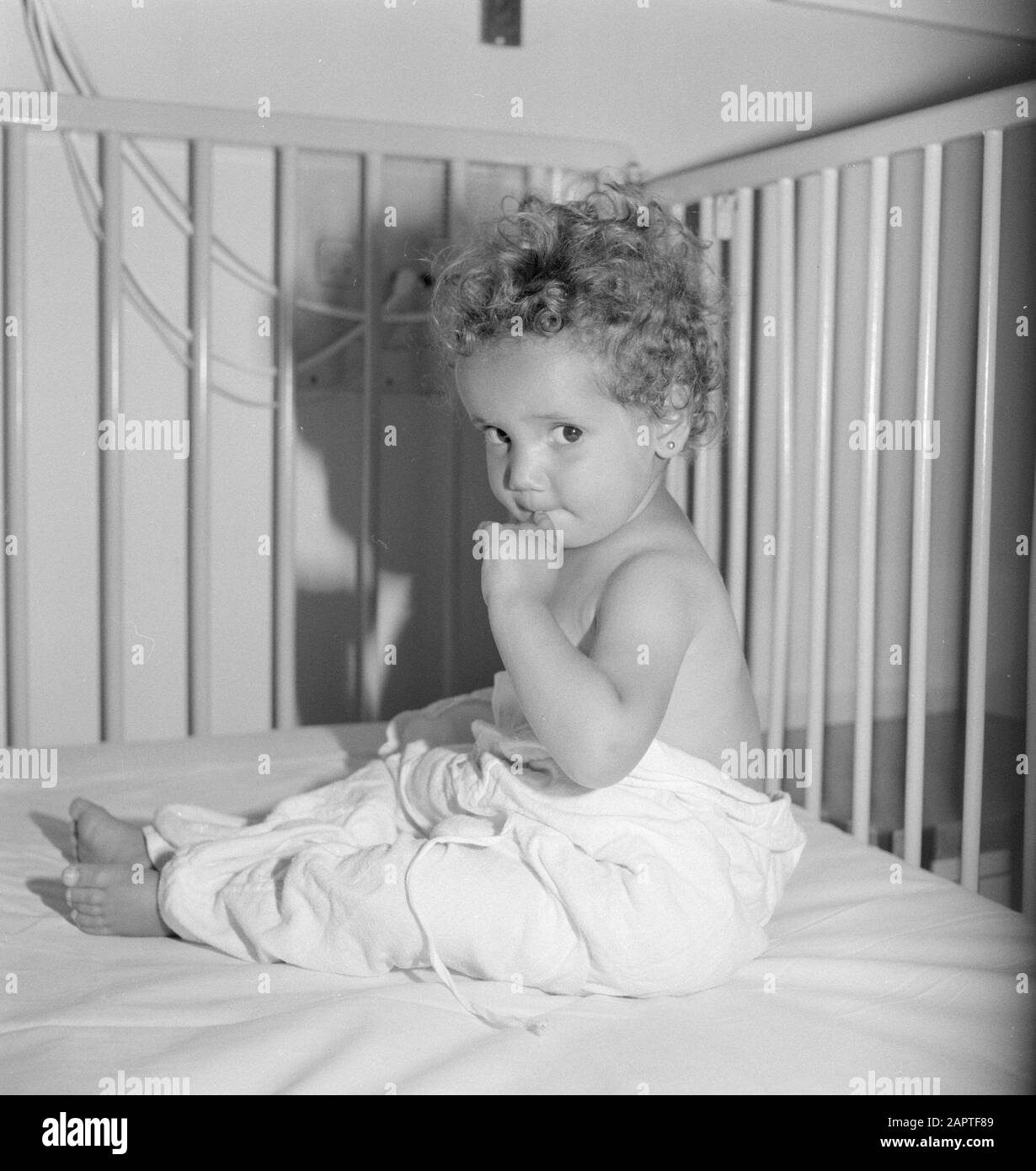 Hadassah university medical center. Department of Pediatrics. A patientje in bed Date: 1960 Location: Israel Keywords: beds, children, hospitals Stock Photo