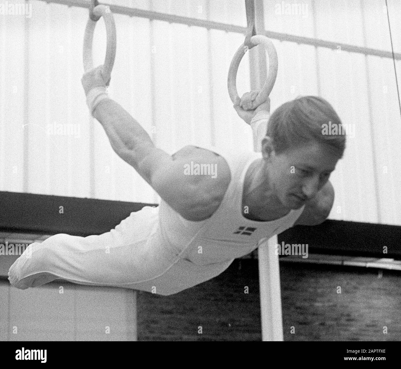 The Netherlands versus Denmark gymnastics at Zaandam. Hans Peter Nielsen (champion Denmark) to rings in action; Stock Photo