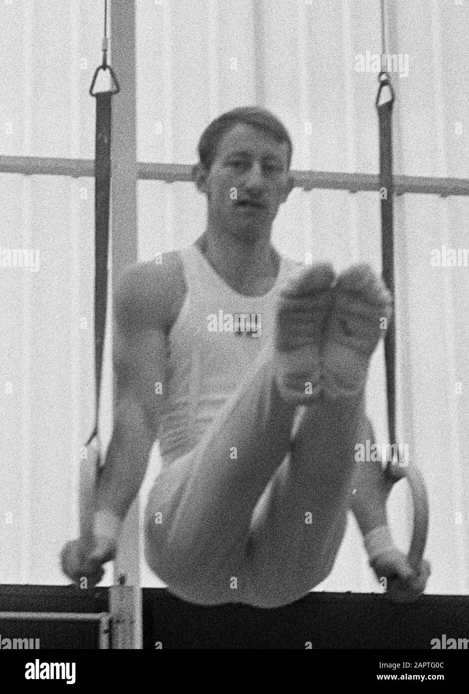 The Netherlands versus Denmark gymnastics at Zaandam. Hans Peter Nielsen (champion Denmark) to rings in action; Stock Photo