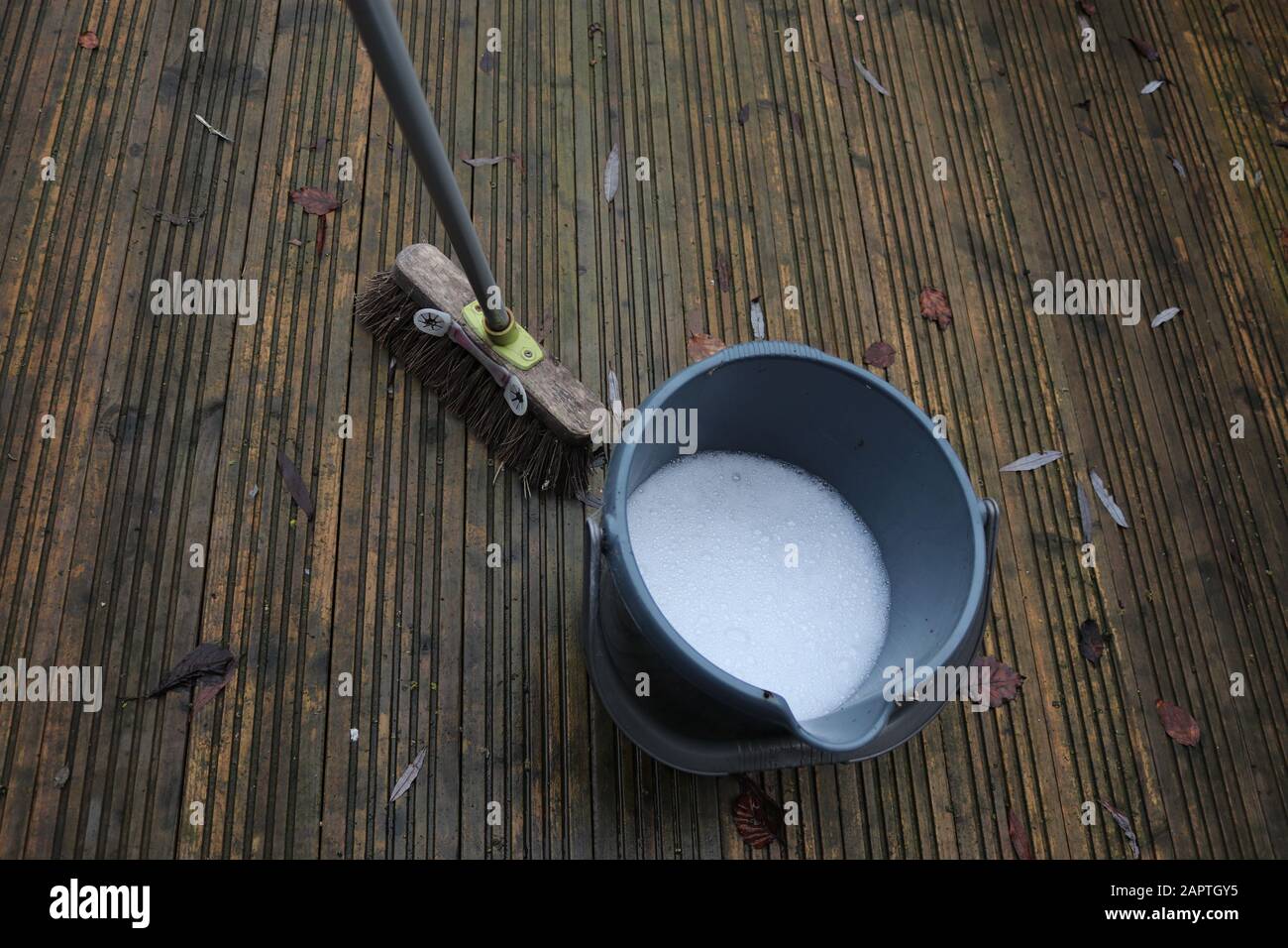 Wash and brush up decking area, soapy water in a bucket and brush for