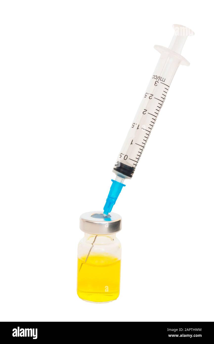 The syringe is inserted into a special vessel with yellow liquid Stock ...