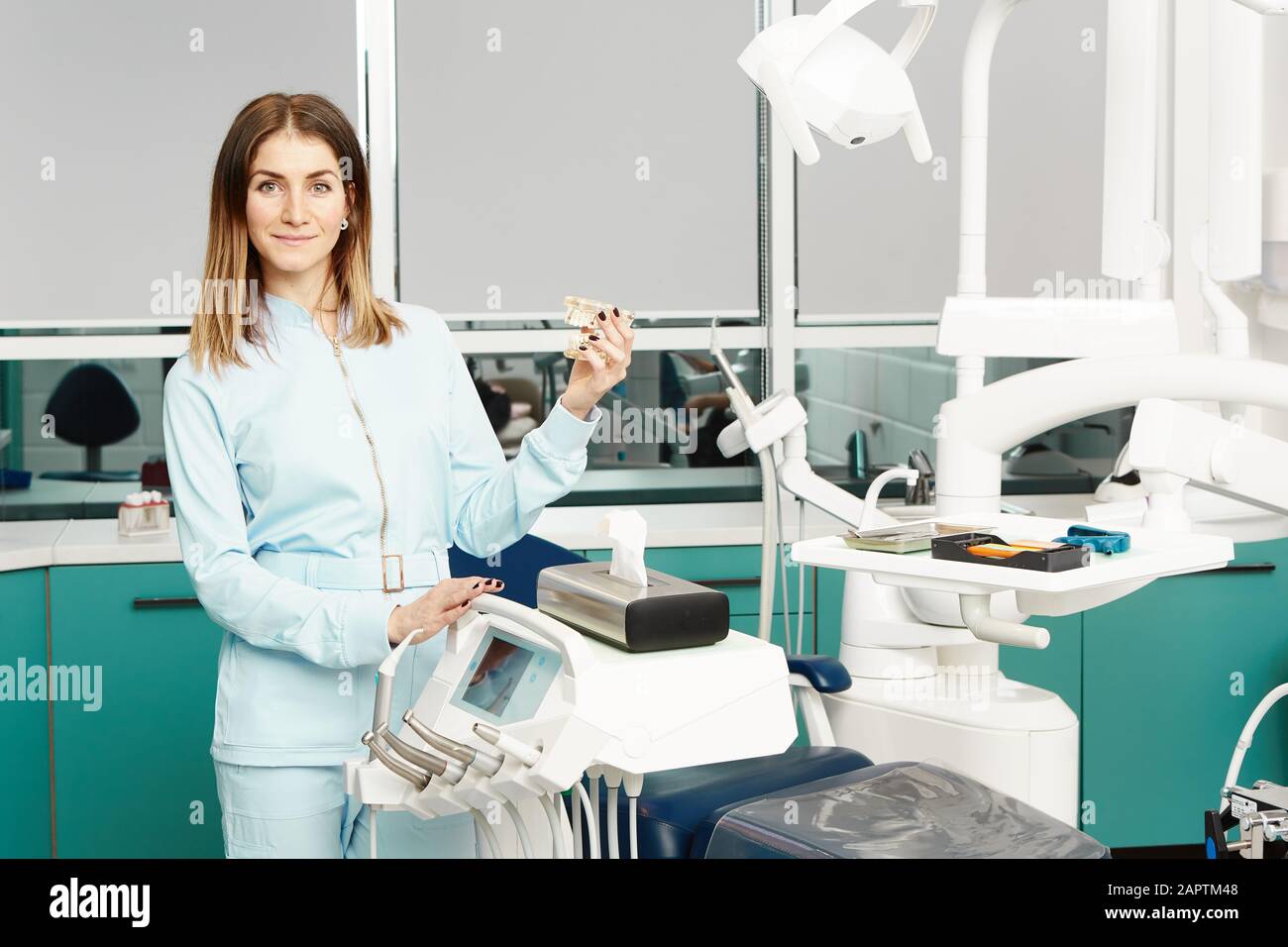 The dental assistant in exam room smiling Stock Photo