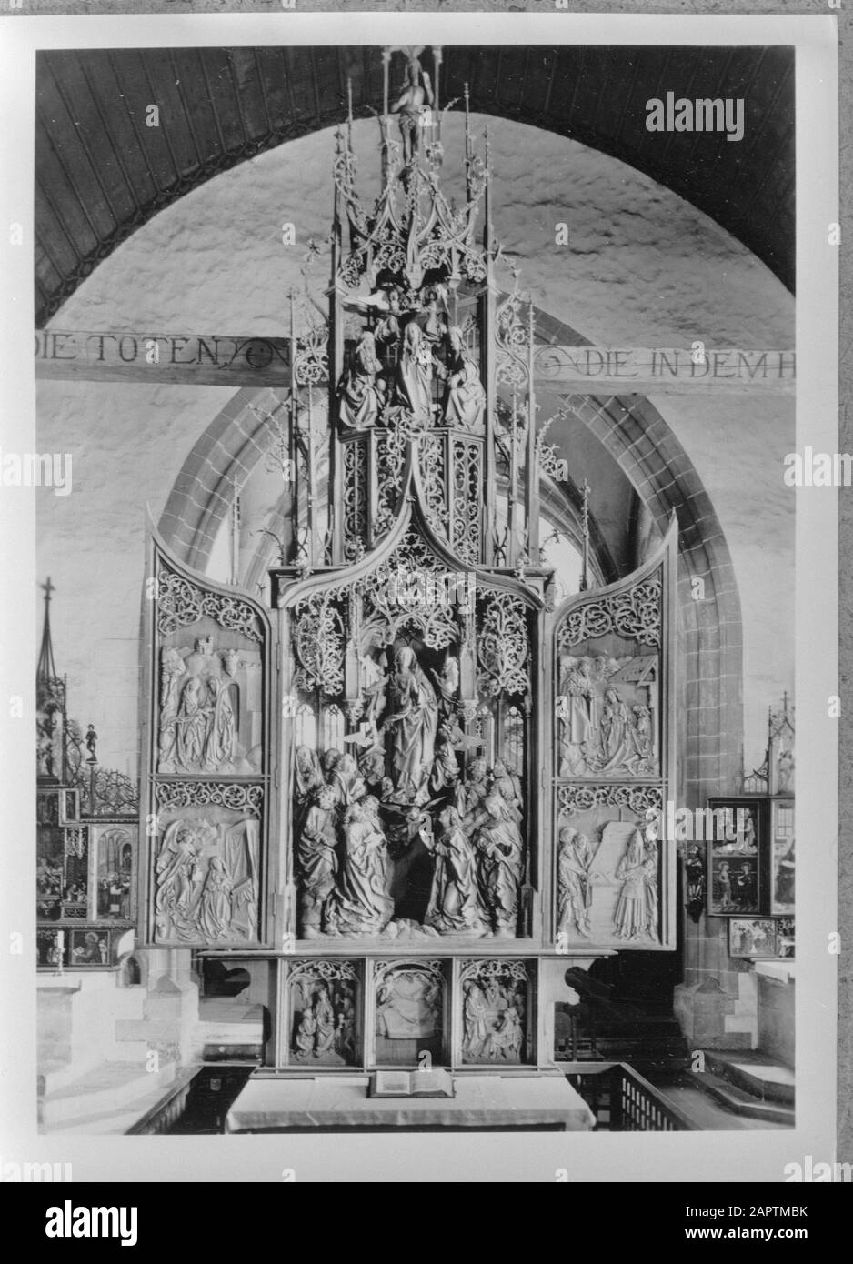 Woodcarving by Tillmann Riemenschneider  The altarpiece above the Mary altar in the Herrgottskirche in Cregingen Annotation: Postcard purchased by Willem vd Poll Date: undated Location: Baden- Württemberg, Creglingen, Germany, West Germany Keywords: statues of saints, carvings, church buildings Stock Photo