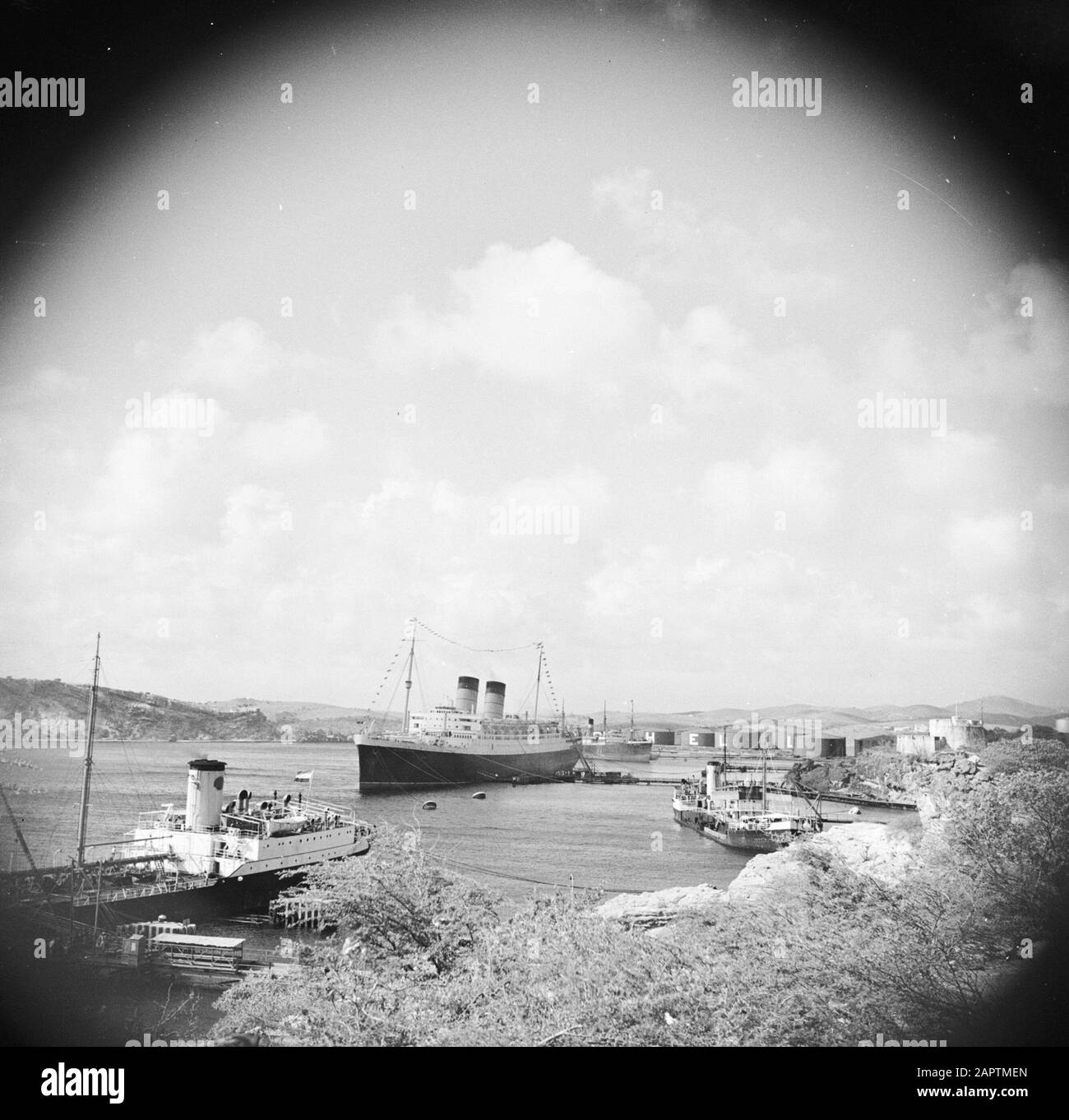 Journey to Suriname and the Netherlands Antilles  The ship de Mauretania in the Caracas Bay on Curaçao Date: 1947 Location: Curaçao Keywords: refineries, ships Stock Photo