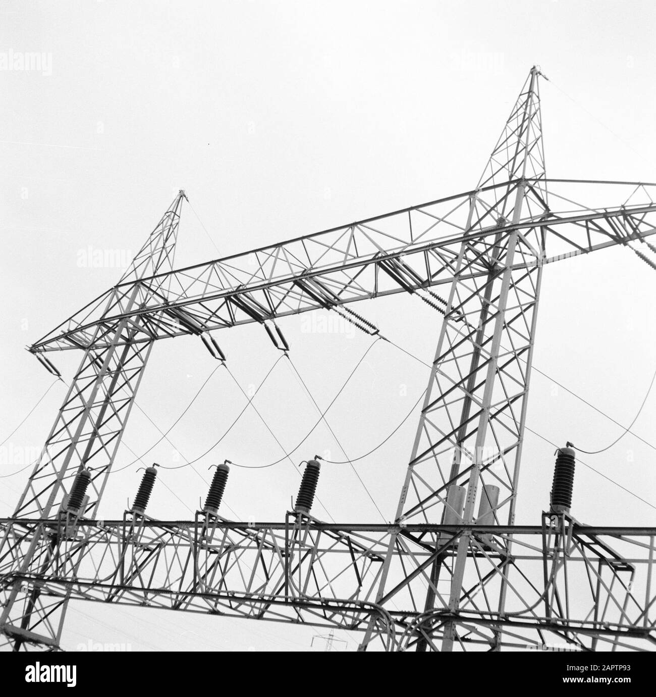 Rhine navigation, report from tug Damco 9: West Germany  High voltage mast with insulators and power lines near Koblenz Date: 1 April 1955 Location: Germany, Koblenz, West Germany Keywords: electricity, high voltage masts, landscapes Stock Photo