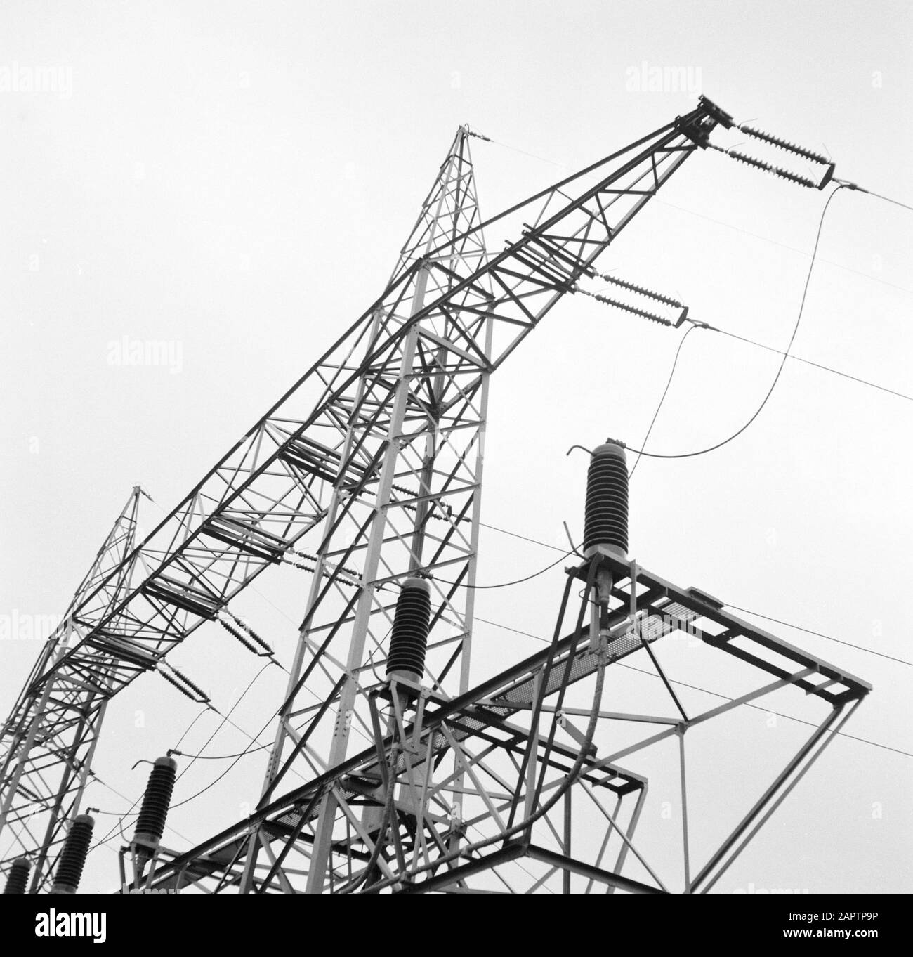 Rhine navigation, report from tug Damco 9: West Germany  High voltage mast with insulators and power lines near Koblenz Date: 1 April 1955 Location: Germany, Koblenz, West Germany Keywords: electricity, high voltage masts, landscapes Stock Photo