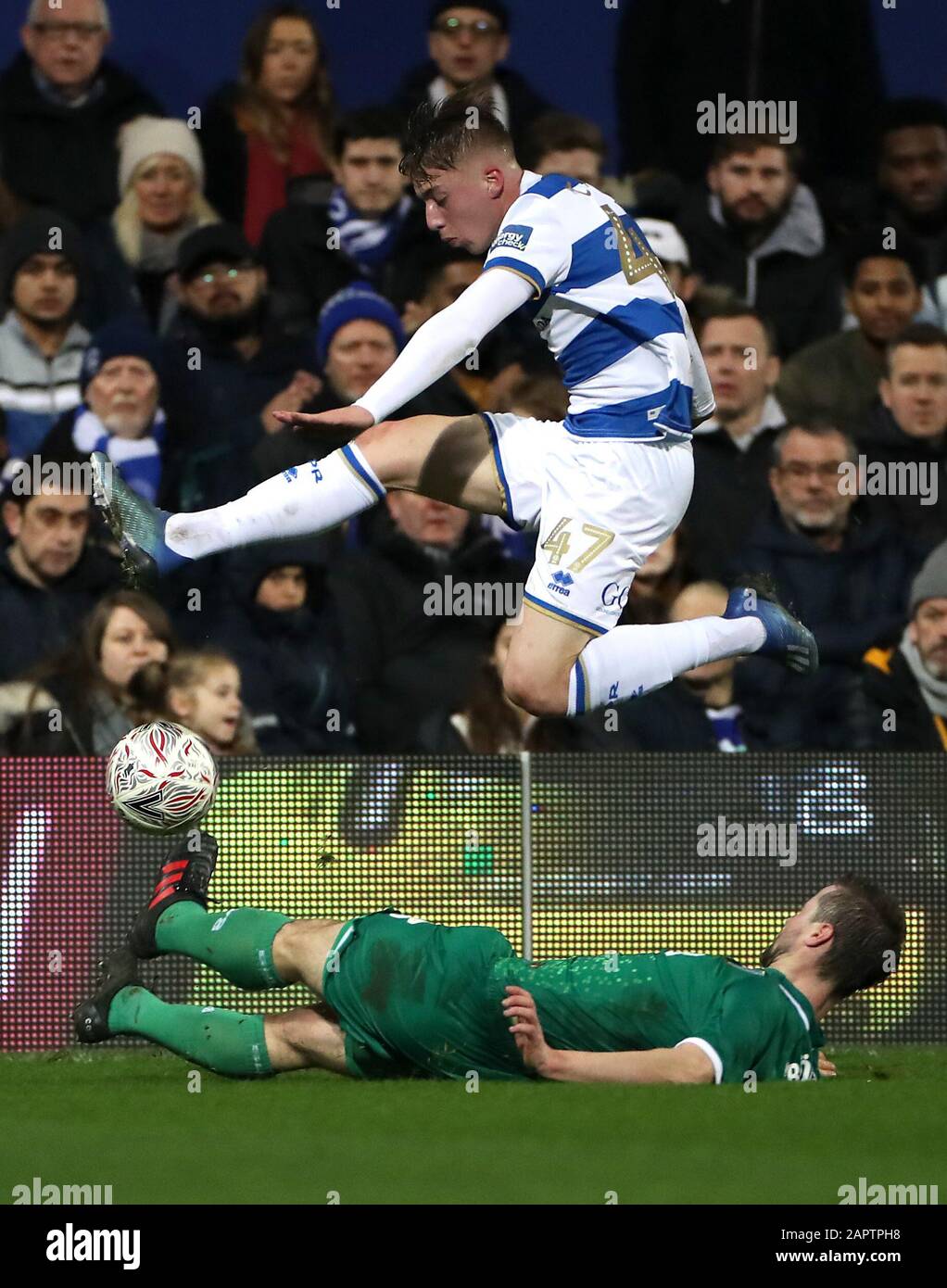 Queens Park Rangers' Jack Clarke (top) and Sheffield Wednesday's Julian Borner battle for the ball during the FA Cup fourth round match at Loftus Road, London. Stock Photo