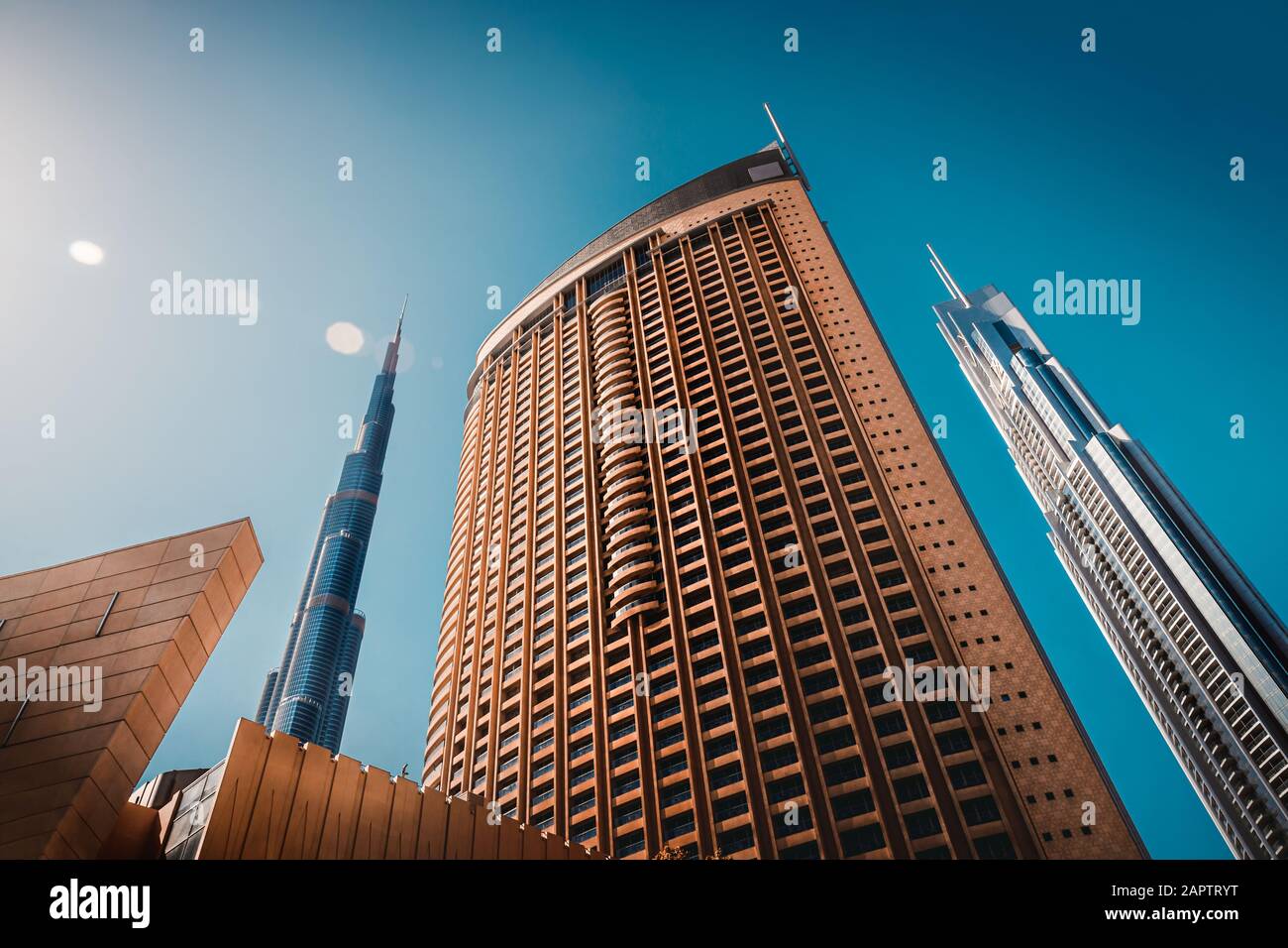 Luxury downtown of Dubai, bottom view on modern futuristic buildings, contemporary city, UAE Stock Photo
