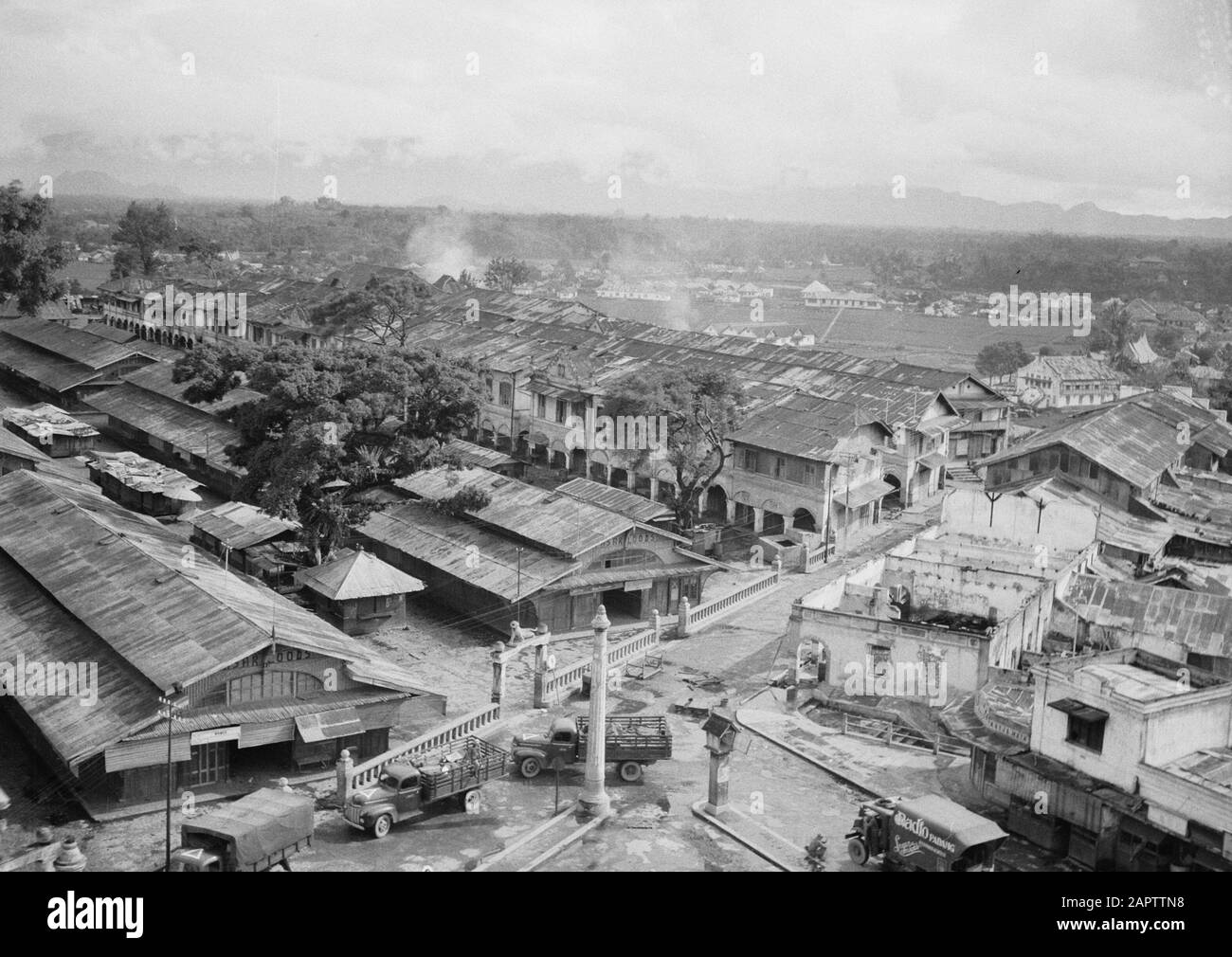 Proceeding to Fort de Kock from Padang Pandjang  In the early morning of December 22nd, 1948 Dutch soldiers moved along the road Padang-Pandjang, towards Fort de - Kock. - Yeah. At a quarter to eight, the first armored cars entered the Republican capital of Sumatra. Except for barriers on the road, the troops encountered virtually no resistance. Through the sound car of Radio-Padang, the population was urged to resume normal work. Here's the beachmaster at the pasar. Annotation: Photo taken from the Jam Gedang (Great Clock Tower) Date: 22 December 1948 Location: Bukittinggi, Indonesia, Dutch E Stock Photo