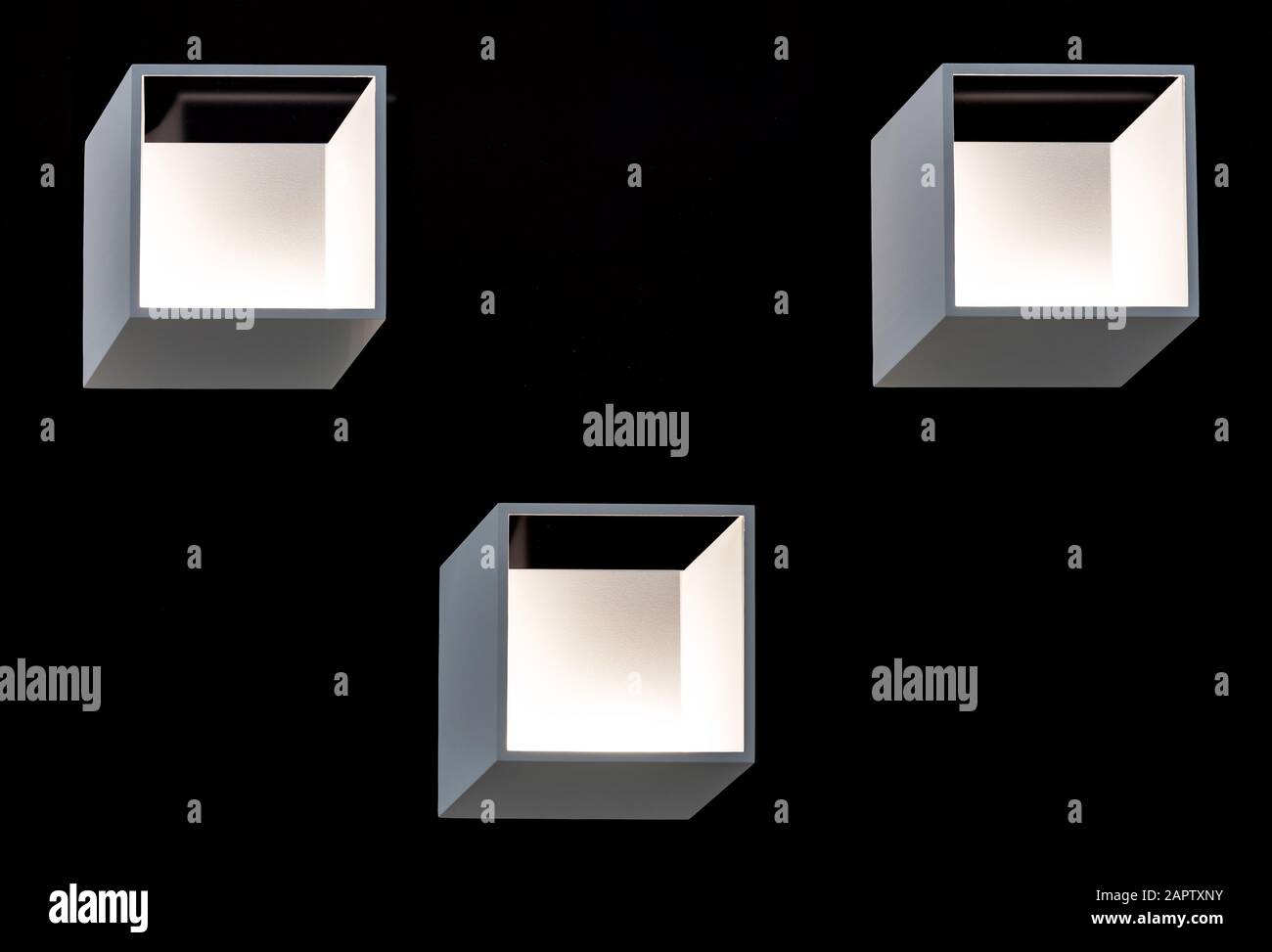 Square LED wall lights on a black background. LED lighting in a modern