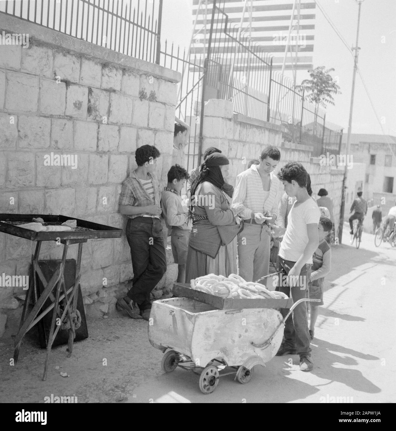 Israel Nazareth Young street vendor with customers Date undated