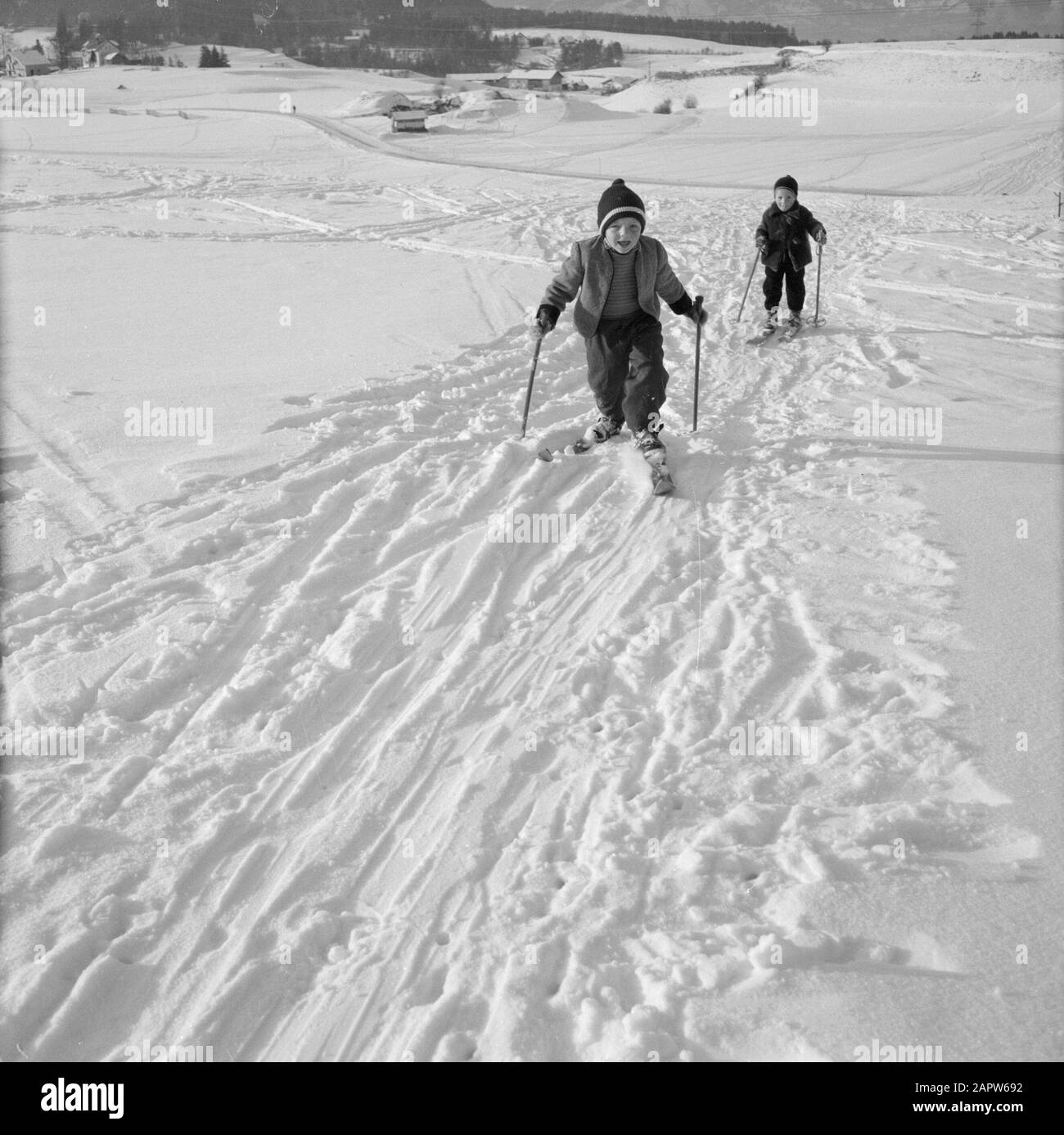 Winter in Tyrol  Children with skis in the snow Date: January 1960 Location: Austria, Sistrans, Tyrol Keywords: landscapes, cross-country skiing, skiing, snow, winter sports Stock Photo