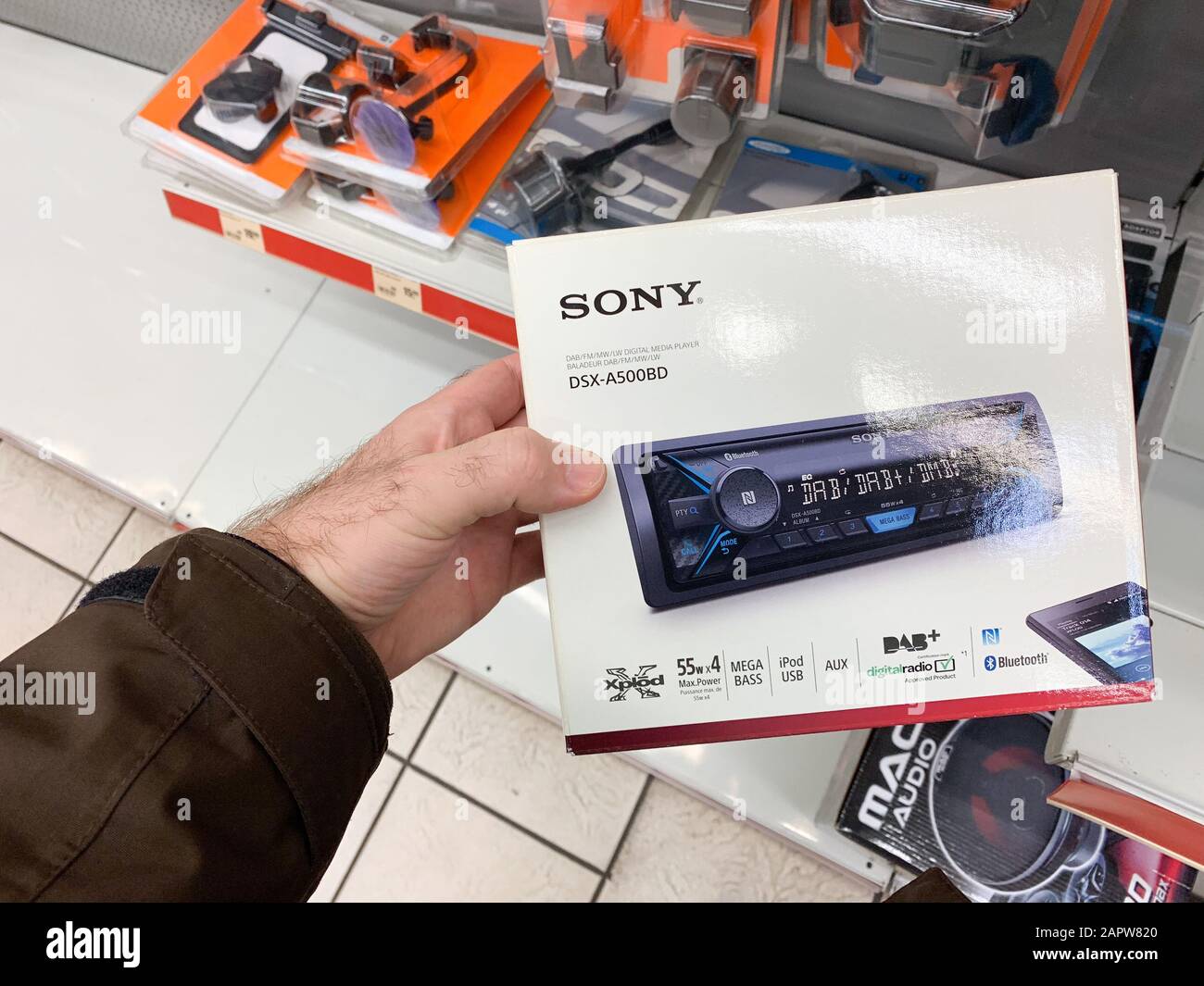 Dortmund, Germany - Mar 25, 2019: Man customer hand holding package of new auto  radio manufactured by SONY modern DXS-A500BD with Xplod , ipad usb  connection and DAB digital radio Stock Photo - Alamy