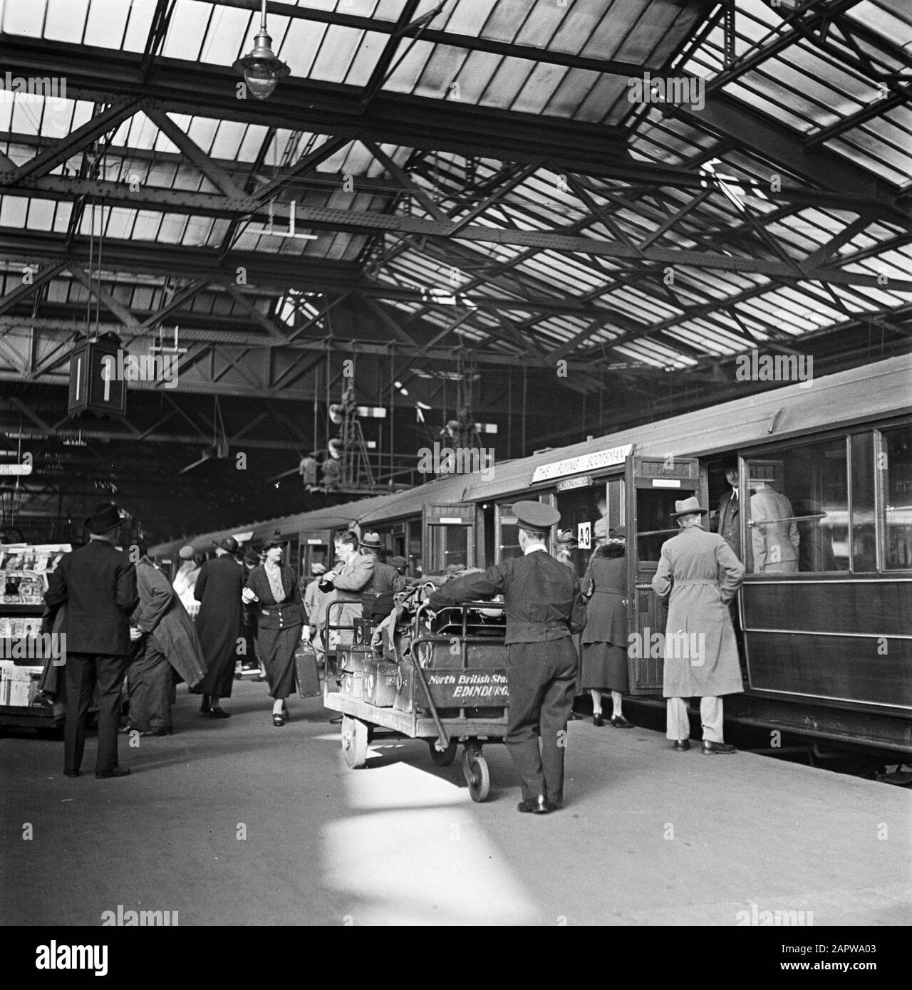 Scotland Edinburgh Waverley Railway Station Porter carries luggage