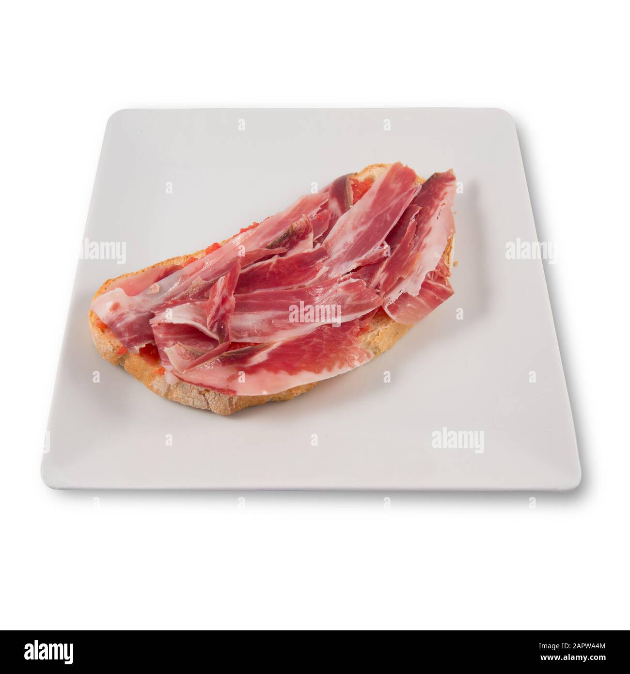 Extremaduran tomato and Iberian ham toast Stock Photo - Alamy