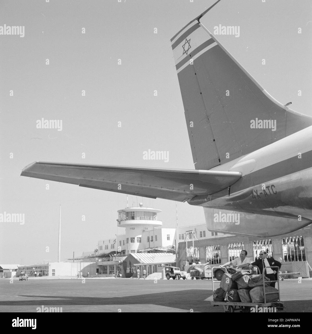 Israel: Lydda Airport (Lod)  Loading and unloading operations at an aircraft Date: undated Location: Israel, Lod Airport, Lydda Airport Keywords: carts, loading and unloading, aviation, traffic stors, aircraft, employees Stock Photo